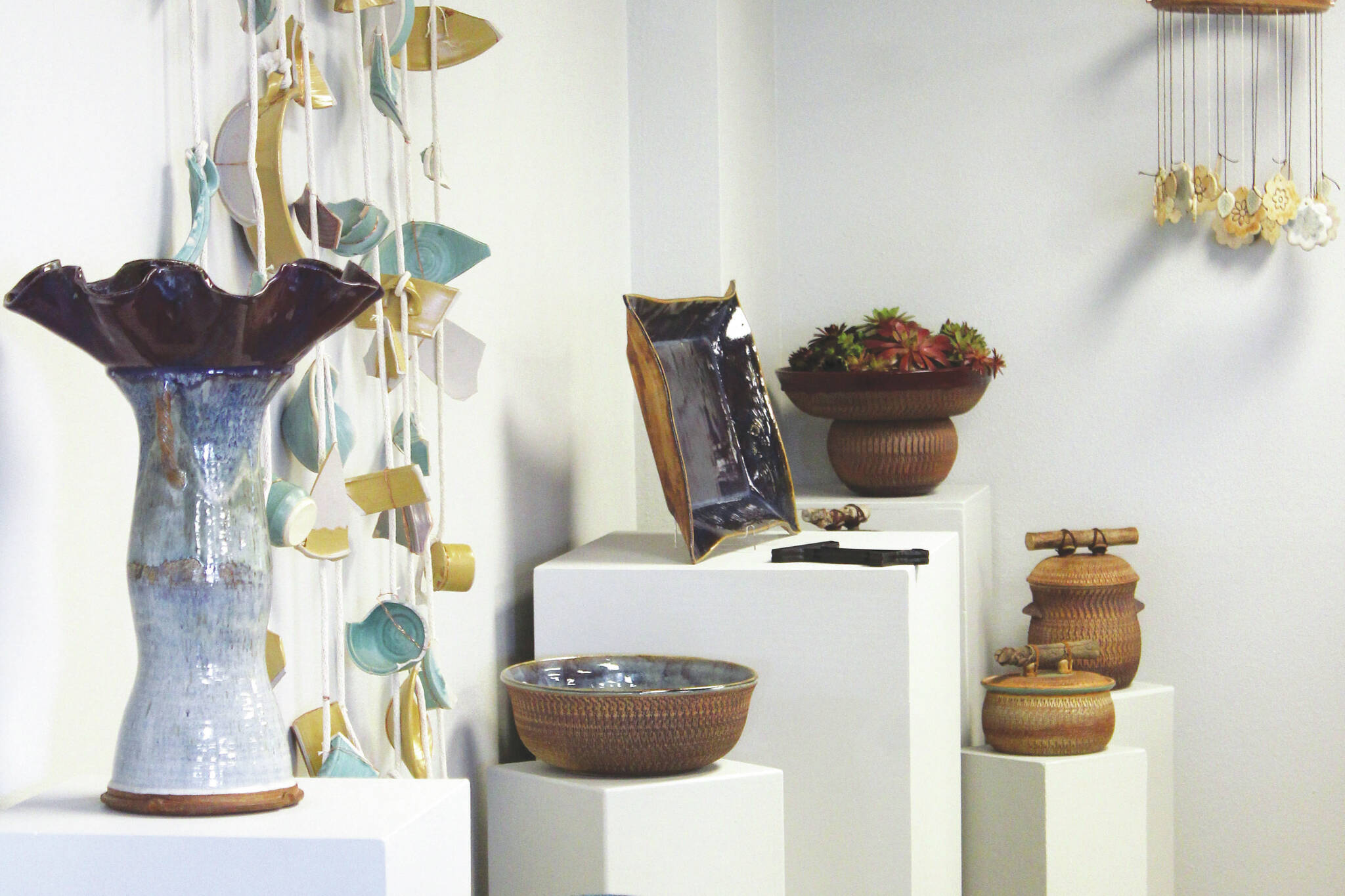 Pottery pieces are displayed as a part of the Kenai Potters’ Guild July show at the Kenai Art Center on Tuesday, July 5, 2022. (Camille Botello/Peninsula Clarion)