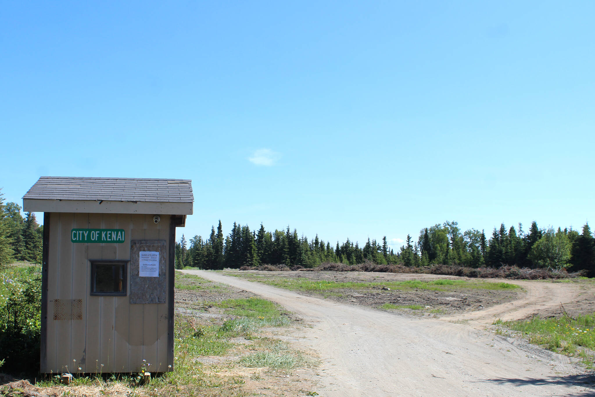 Slash is piled at the City of Kenai’s slash disposal site on Wednesday, June 15, 2022, in Kenai, Alaska. The Kenai Peninsula Borough will use $300,000 in general funds to set up temporary slash disposal sites in multiple communities throughout the borough. (Ashlyn O’Hara/Peninsula Clarion)