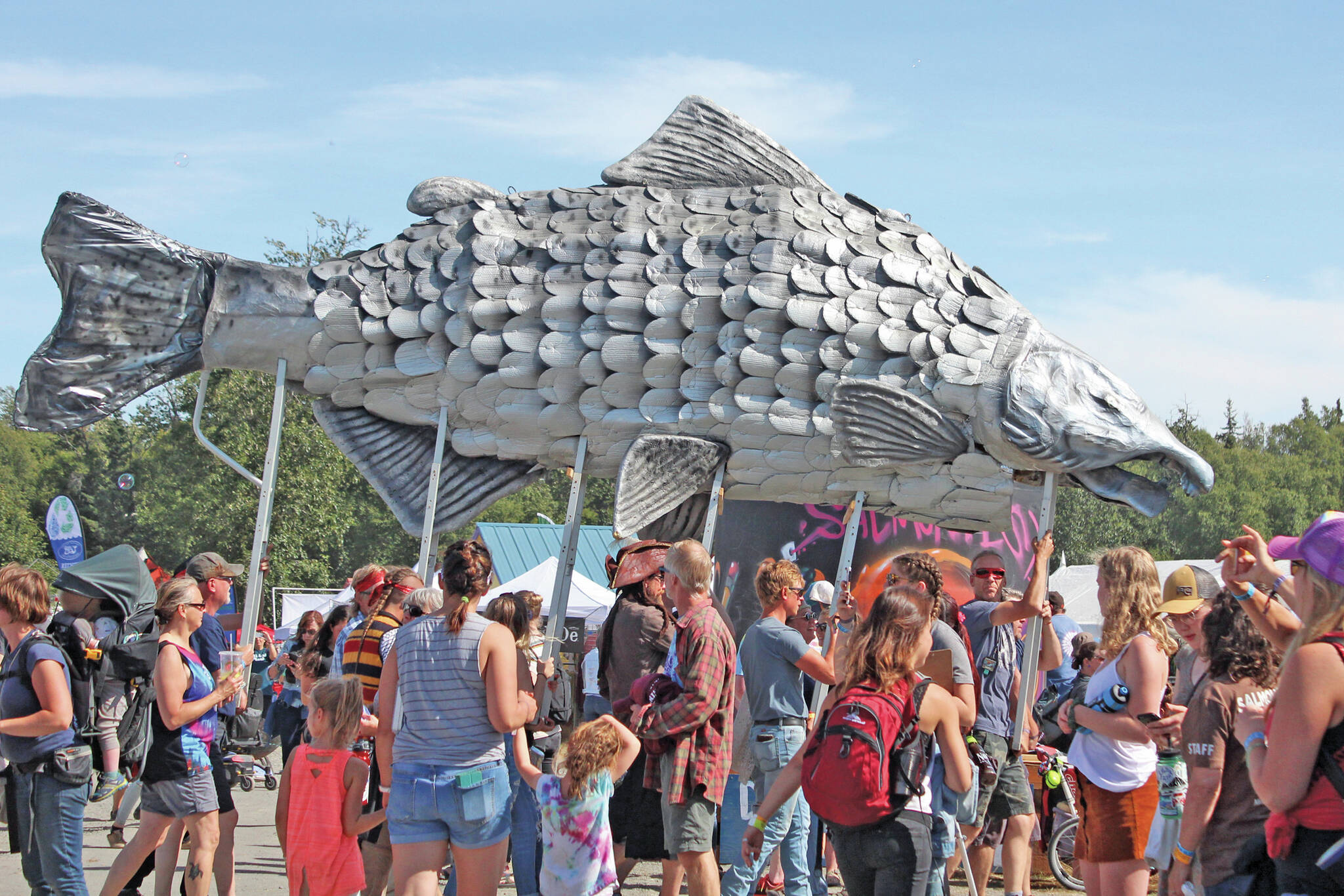 Megan Pacer / Homer News 
A giant silver salmon is paraded through Salmonfest on Aug. 3, 2019, in Ninilchik.