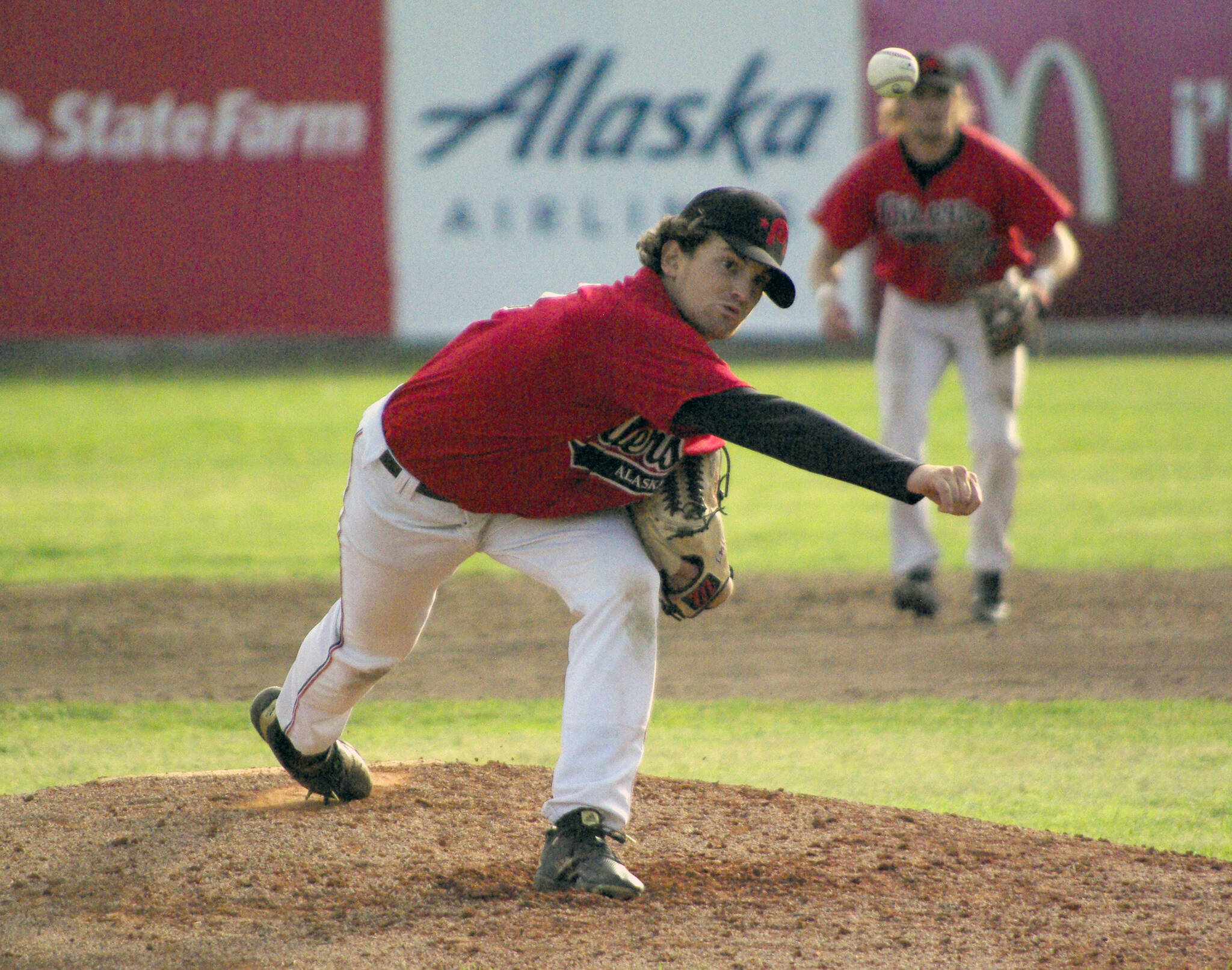 Oilers starter Conner Kershaw delivers to the Chugiak-Eagle River Chinooks on Friday, July 8, 2022, at Coral Seymour Memorial Park in Kenai, Alaska. (Photo by Jeff Helminiak/Peninsula Clarion)