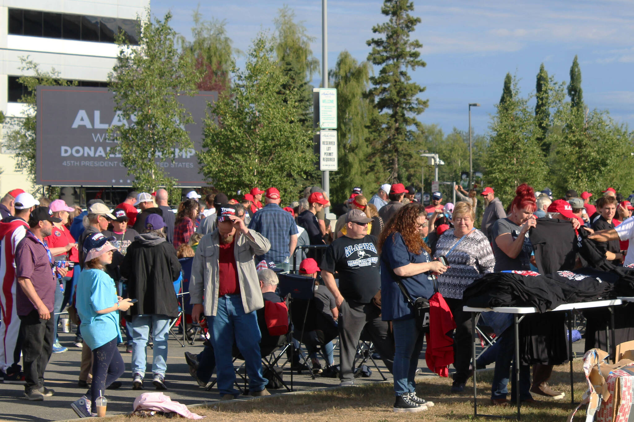 People gather outside of the Alaska Airlines Center, where a Save America rally was being held, on Saturday, July 9, 2022, in Anchorage, Alaska. Former President Donald Trump, U.S. Senate candidate Kelly Tshibaka and U.S. House candidate Sarah Palin were among the event’s speakers. (Ashlyn O’Hara/Peninsula Clarion)