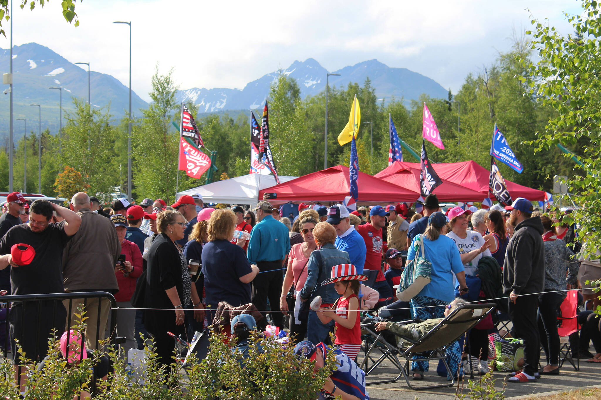 People gather outside of the Alaska Airlines Center, where a Save America rally was being held, on Saturday, July 9, 2022 in Anchorage, Alaska. Former President Donald Trump, U.S. Senate candidate Kelly Tshibaka and U.S. House candidate Sarah Palin were among the event’s speakers. (Ashlyn O’Hara/Peninsula Clarion)