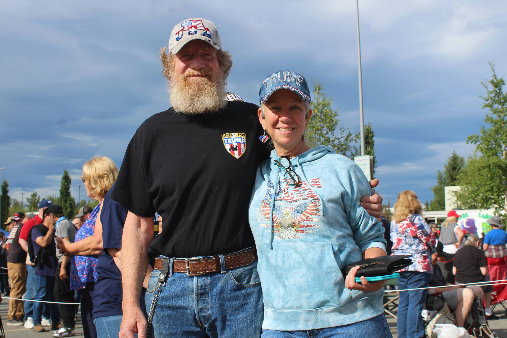 David (left) and April (right) Orth wait to enter the Alaska Airlines Center for a Save America rally on Saturday, July 9, 2022, in Anchorage, Alaska. Former President Donald Trump, U.S. Senate candidate Kelly Tshibaka and U.S. House candidate Sarah Palin were among the events speakers. (Ashlyn O’Hara/Peninsula Clarion)