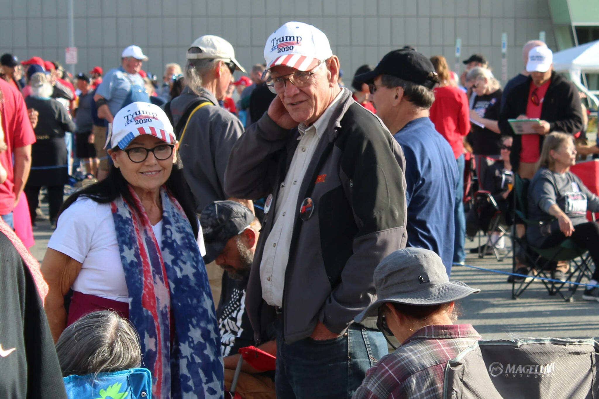 Mike (left) and Kathy (right) Medcoff wait to enter the Alaska Airlines Center for a Save America rally on Saturday, July 9, 2022, in Anchorage, Alaska. Former President Donald Trump, U.S. Senate candidate Kelly Tshibaka and U.S. House candidate Sarah Palin were among the events speakers. (Ashlyn O’Hara/Peninsula Clarion)