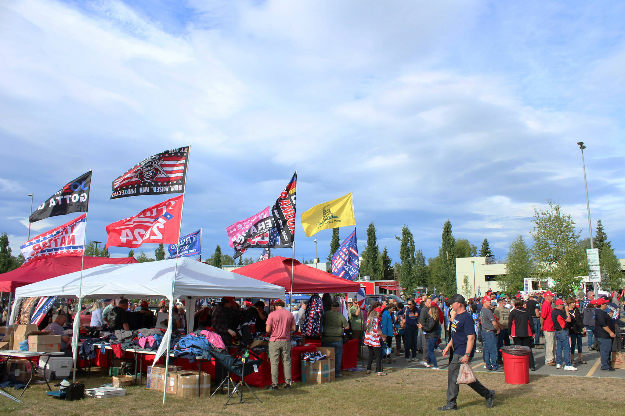 Vendors sell flags and other merchandise outside of the Alaska Airlines Center, where a Save America rally was being held, on Saturday, July 9, 2022, in Anchorage, Alaska. Former President Donald Trump, U.S. Senate candidate Kelly Tshibaka and U.S. House candidate Sarah Palin were among the event’s speakers. (Ashlyn O’Hara/Peninsula Clarion)