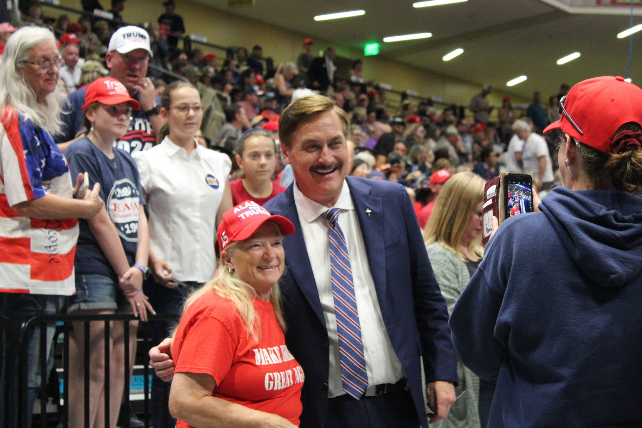 My Pillow CEO and political activist Mike Lindell poses with a Trump supporter Save America rally at the Alaska Airlines Center in Anchorage Alaska, on Saturday, July 9, 2022, in Anchorage, Alaska. (Photo by Ashlyn O’Hara/Peninsula Clarion)