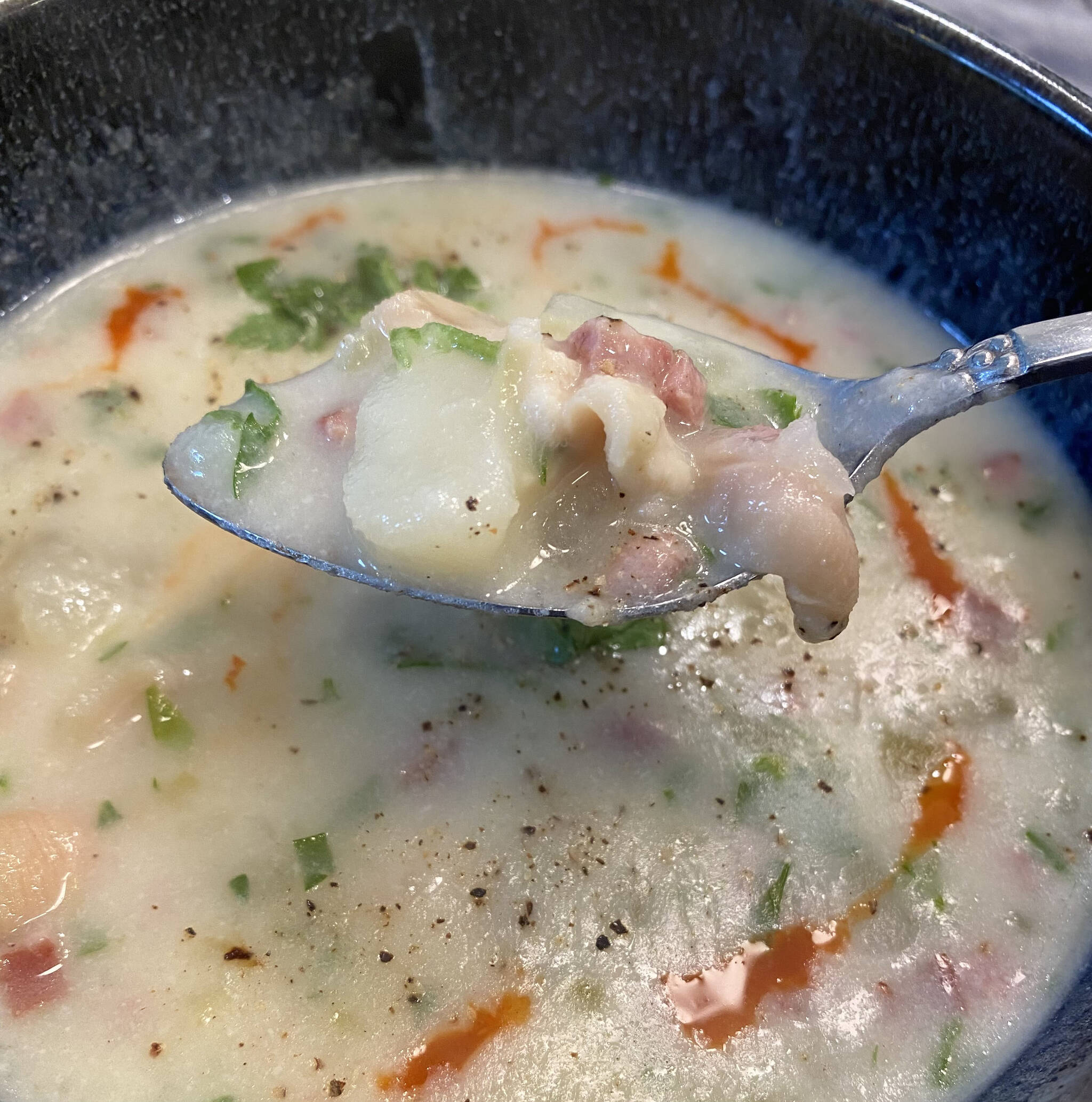 Freshly dug clams are blended into a creamy chowder of potatoes, onions, shallots, meat and spices. (Photo by Tressa Dale/Peninsula Clarion)