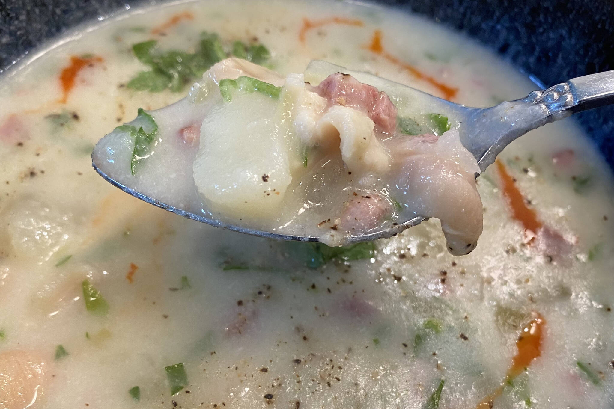 Freshly dug clams are blended into a creamy chowder of potatoes, onions, shallots, meat and spices. (Photo by Tressa Dale/Peninsula Clarion)