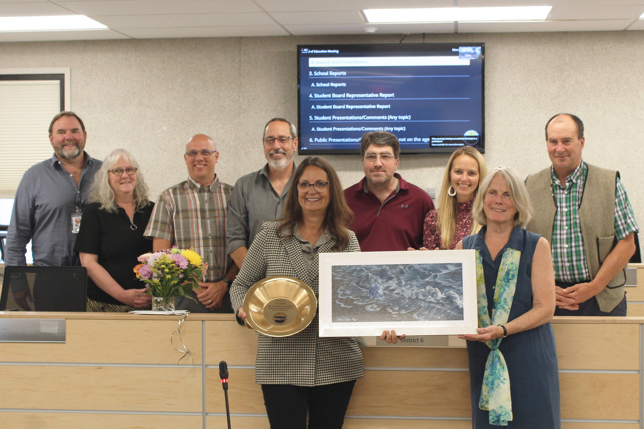 Lisa Gabriel, front left, is honored for her 28 years of service to the Kenai Peninsula Borough School District during a Board of Education meeting on Monday, July 11, 2022, in Soldotna, Alaska. (Ashlyn O’Hara/Peninsula Clarion)