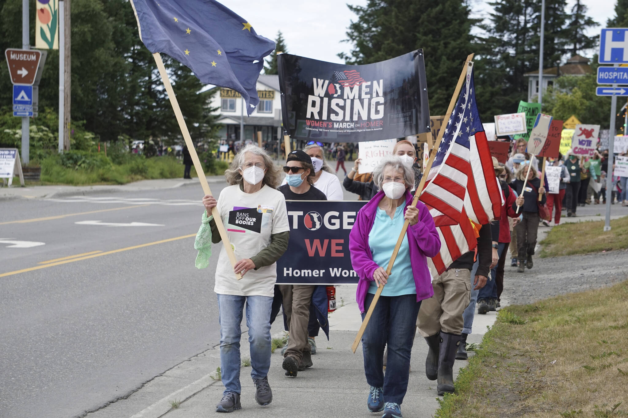 A group of about 400 people march along Pioneer Avenue for the "Women's March: Bans Off Our Bodies" protest on Saturday, July 9, 2022, in Homer, Alaska. (Photo by Michael Armstrong/Homer News)