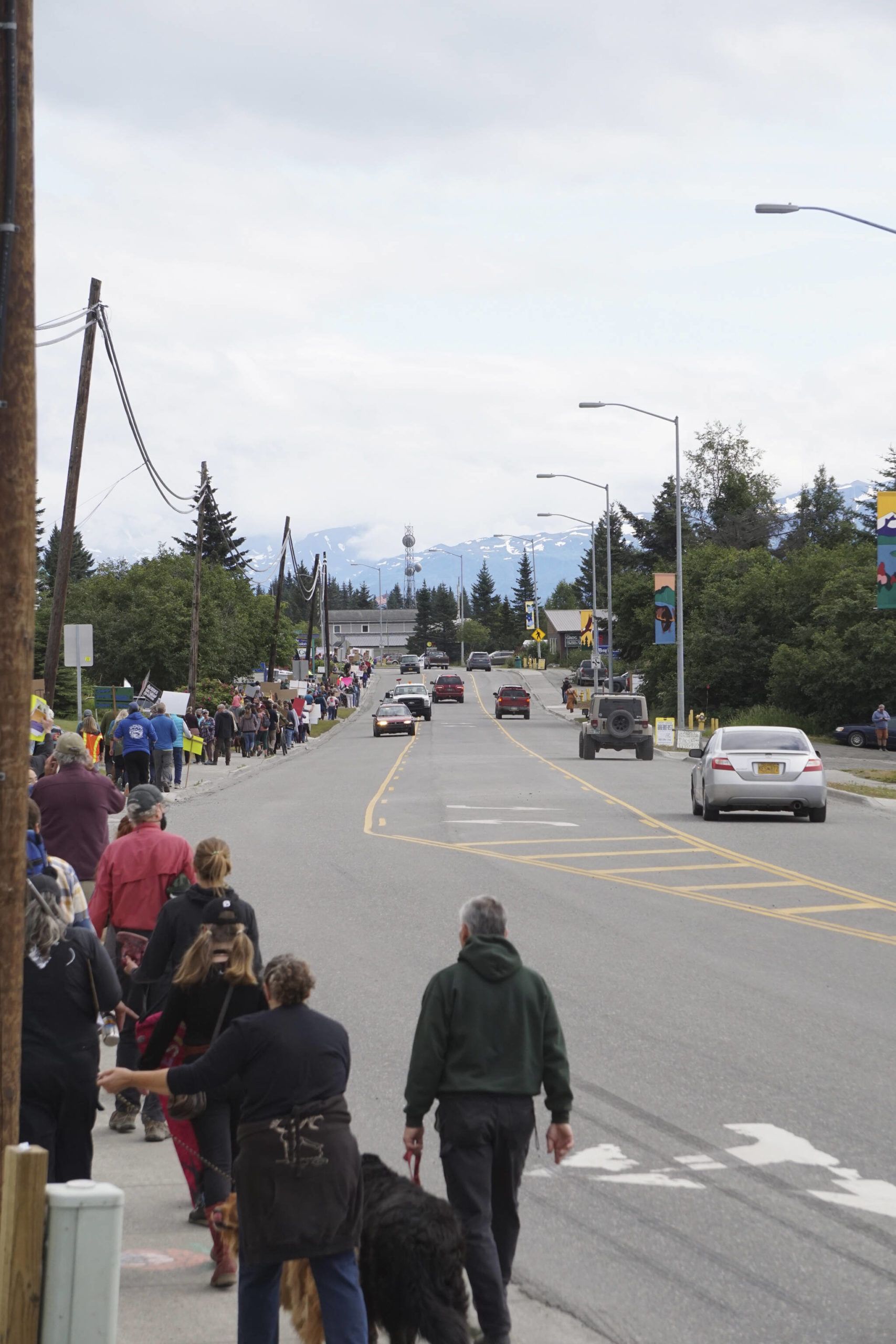 A group of about 400 people march along Pioneer Avenue for the "Women's March: Bans Off Our Bodies" protest on Saturday, July 9, 2022, in Homer, Alaska. The line of marchers stretched from about Main Street to Kachemak Way (Photo by Michael Armstrong/Homer News)
