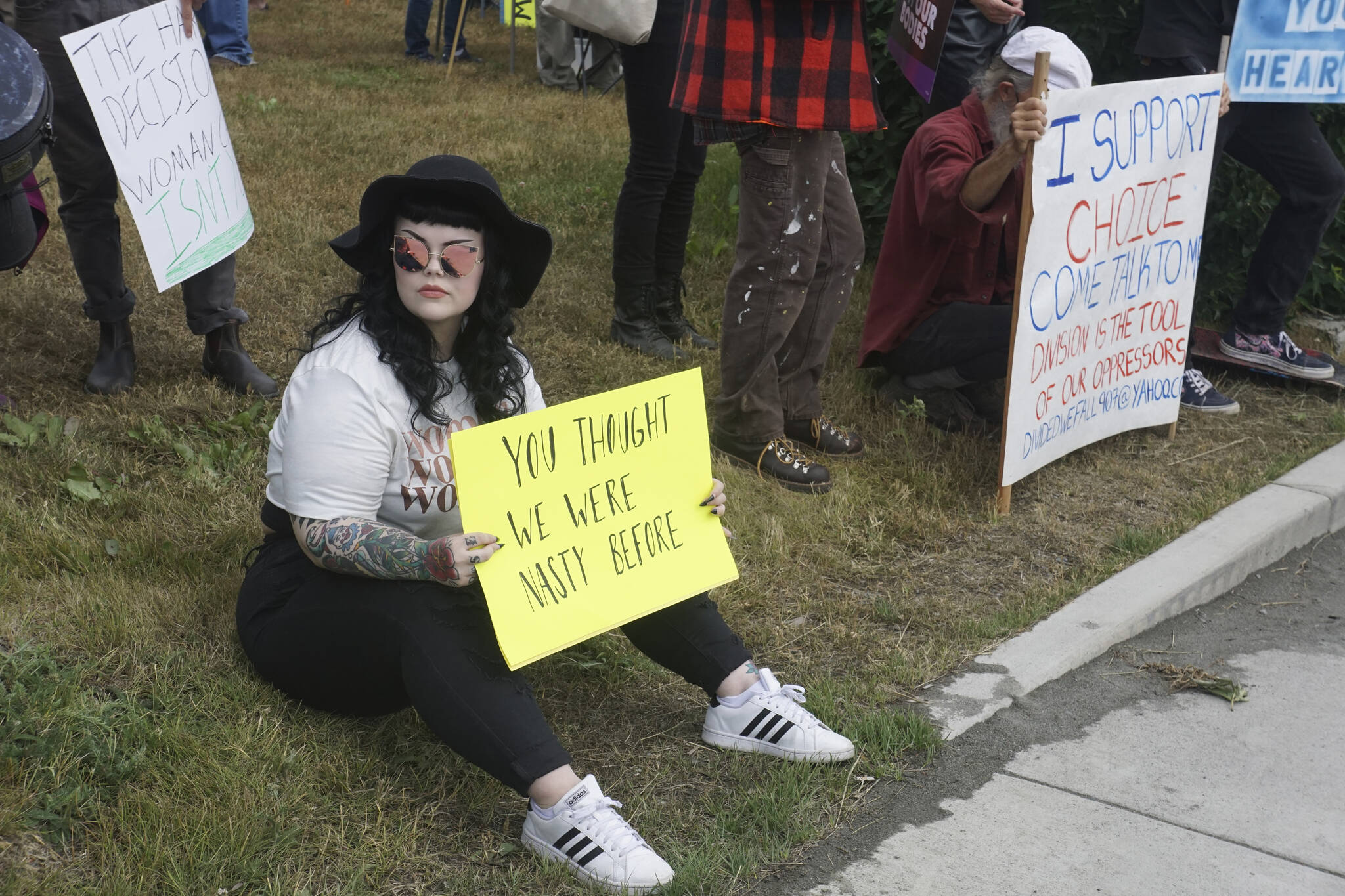 Salem Carrico-Roger holds a sign that reads "You thought we were nasty before" at the "Women's March: Bans Off Our Bodies" protest on Saturday, July 9, 2022, at WKFL Park in Homer, Alaska. (Photo by Michael Armstrong/Homer News)