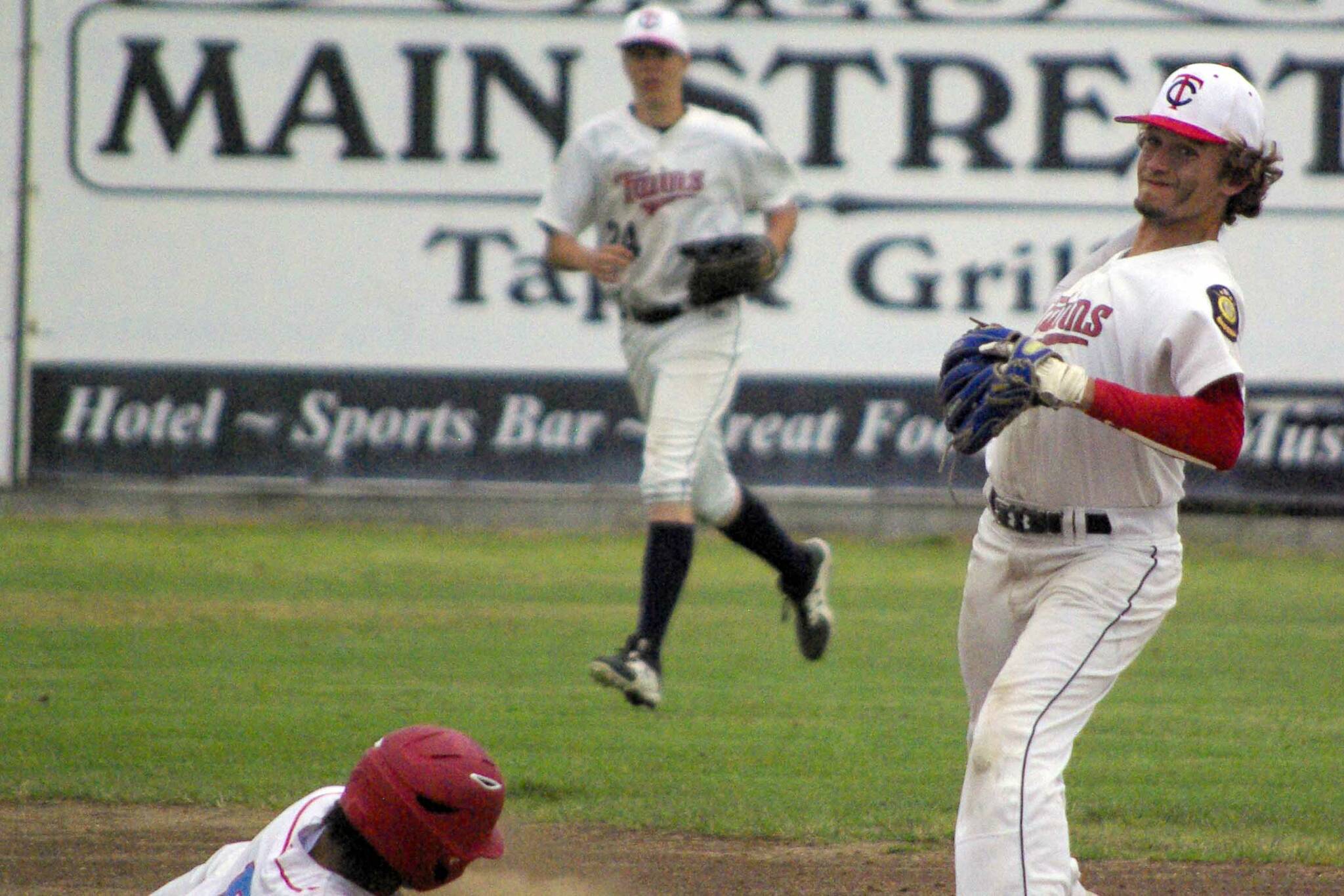 Post 20 Twins' Hunter Williams gets the force at second on East's Alan Contreras but is late throwing to first for the double play Wednesday, July 13, 2022, at Coral Seymour Memorial Park in Kenai, Alaska. (Photo by Jeff Helminiak/Peninsula Clarion)