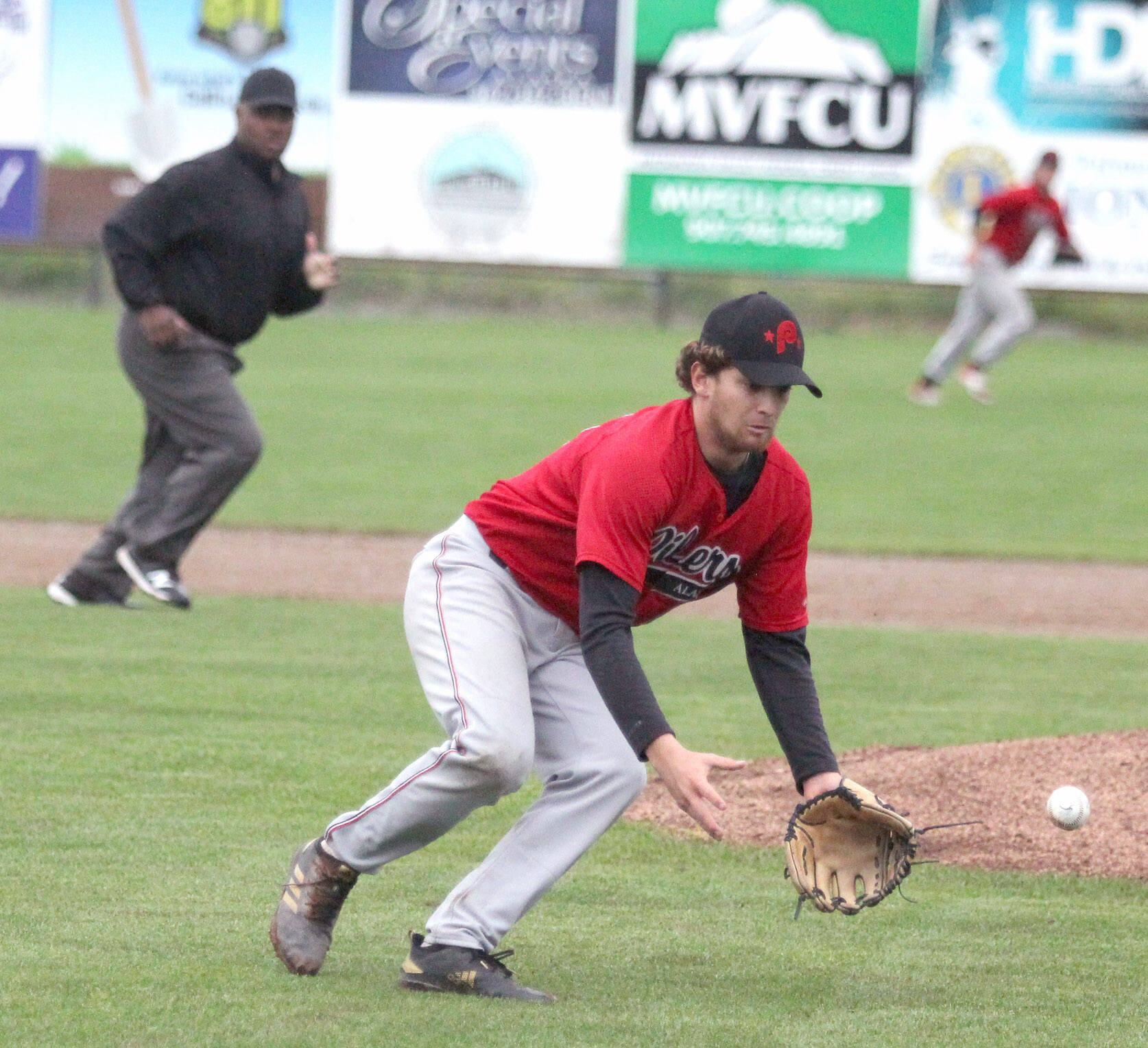 Peninsula Oilers pitcher Conner Kershaw fields a short ground ball against the Mat-Su Miners on Friday, July 15, 2022, at Hermon Brothers Field in Palmer, Alaska. (Photo by Jeremiah Bartz/Frontiersman)