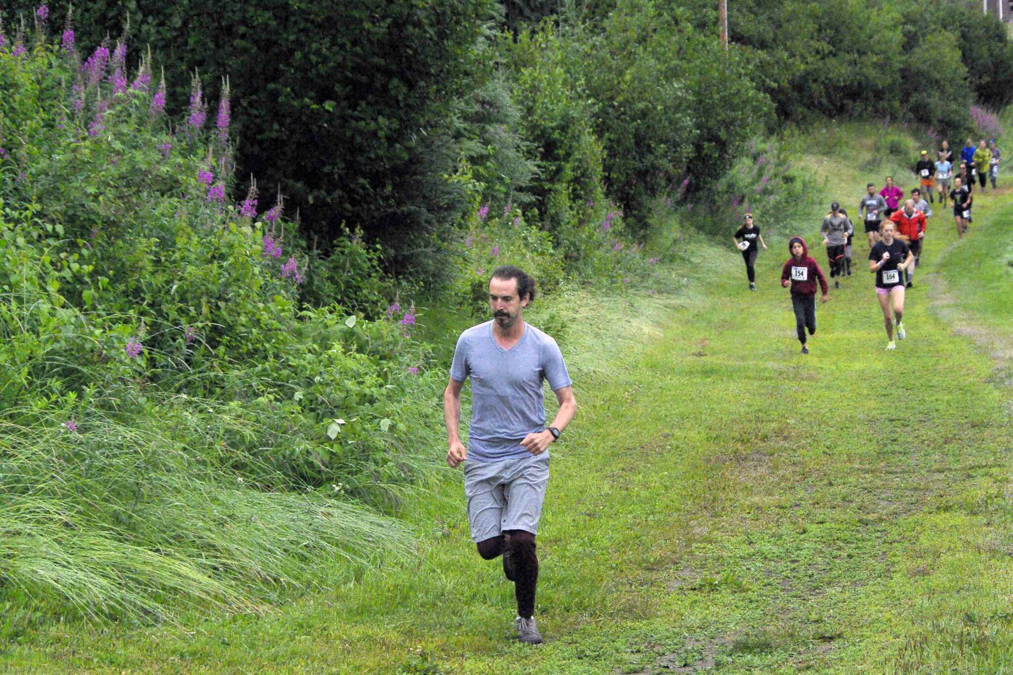 Competitors start the Unity Run on Saturday, July 16, 2022, at Tsalteshi Trails just outside of Soldotna, Alaska. (Photo by Jeff Helminak/Peninsula Clarion)