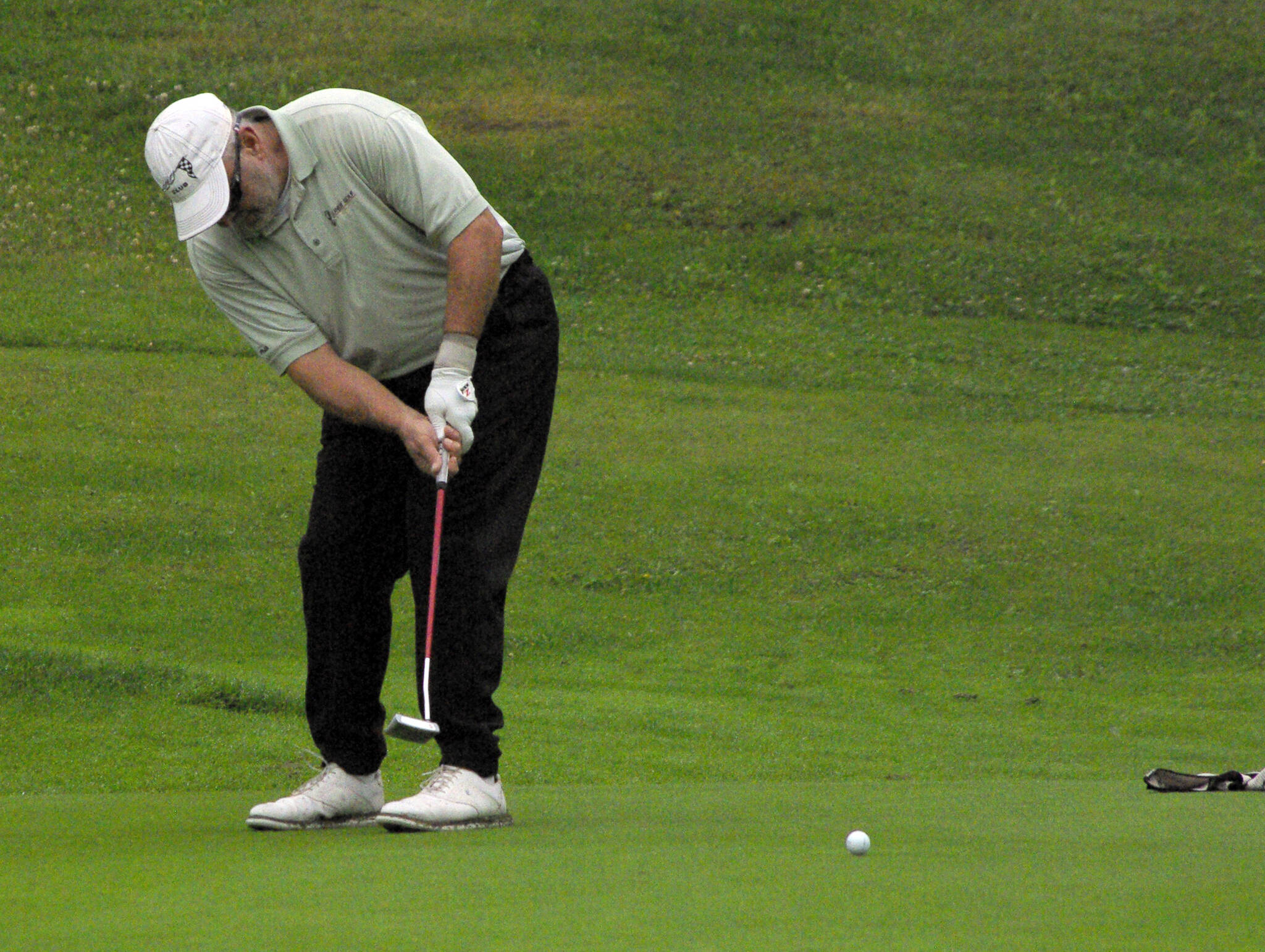 Rich Lundahl makes a 60-foot putt for birdie on No. 17 during the Kenai Peninsula Open and Pro-Am at Birch Ridge Golf Course in Soldotna, Alaska, on Sunday, July 17, 2022. Lundahl won the open division. (Photo by Jeff Helminiak/Peninsula Clarion)