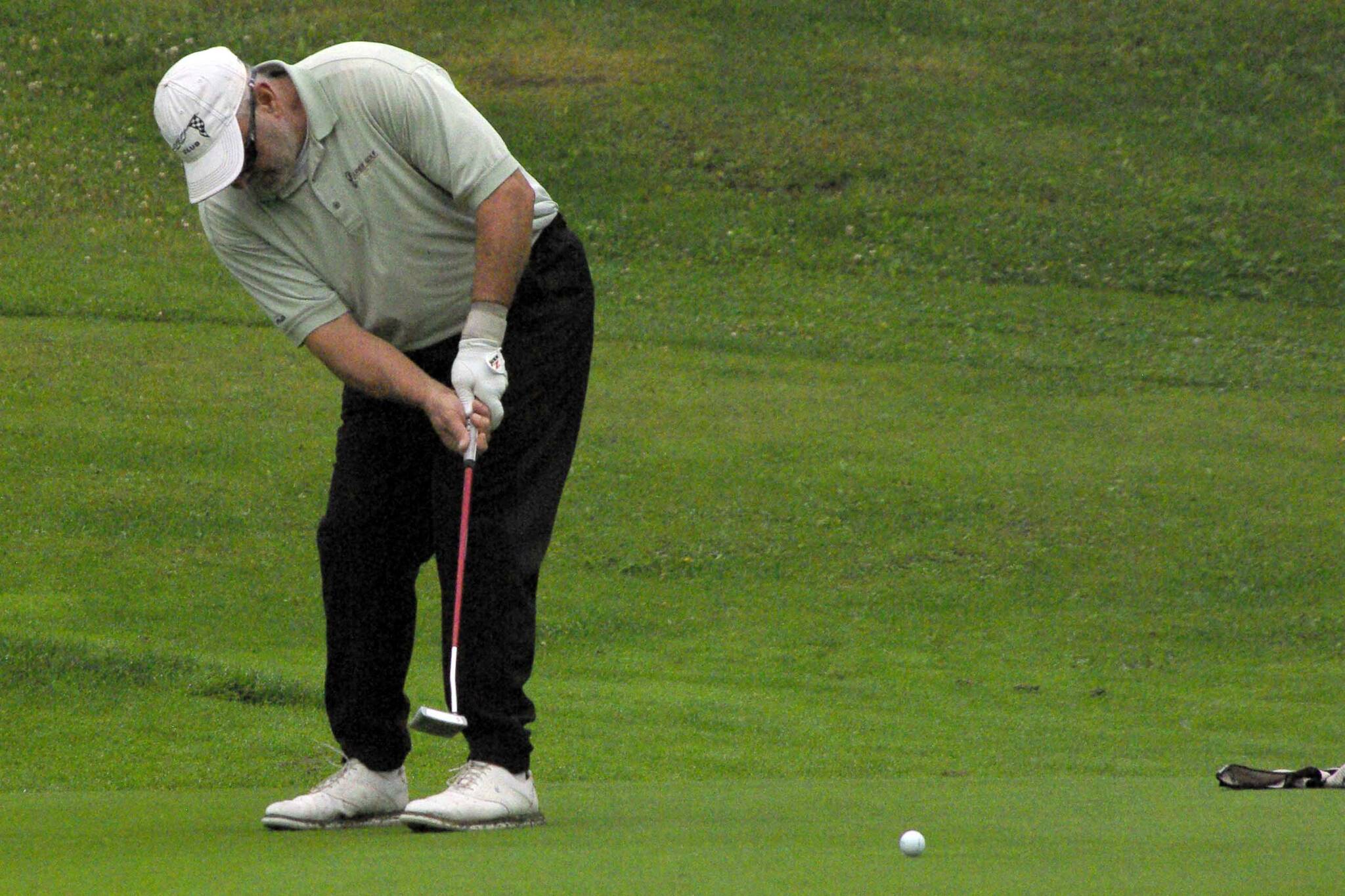 Rich Lundahl makes a 60-foot putt for birdie on No. 17 during the Kenai Peninsula Open and Pro-Am at Birch Ridge Golf Course in Soldotna, Alaska, on Sunday, July 17, 2022. Lundahl won the open division. (Photo by Jeff Helminiak/Peninsula Clarion)