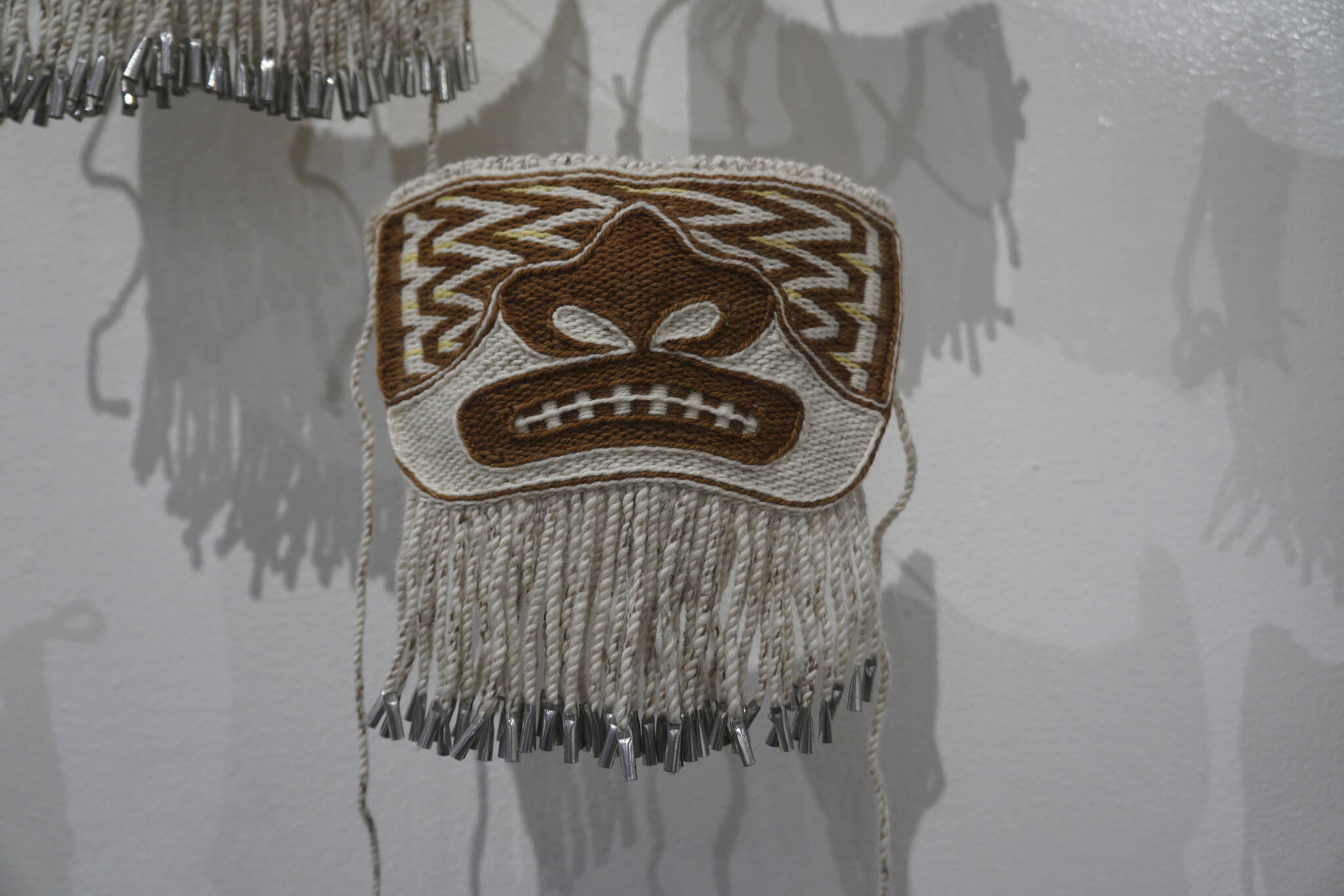 One of the Chilkat protector masks made in a Zoom workshop led by Lily Wooshkindein Da.áat Hope of Juneau and on display in the “Protection: Adaptation and Resistance” show at the Pratt Museum & Park in Homer, Alaska. The show continues through Sept. 24, 2022. (Photo by Michael Armstrong/Homer News)