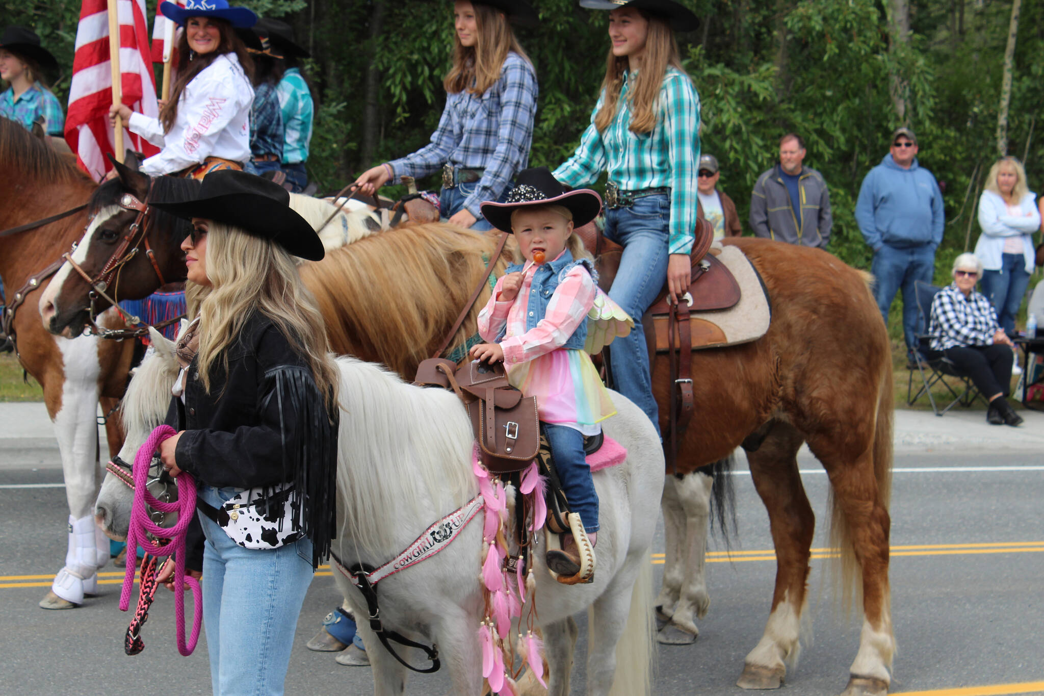 Riders with Alaska C&C Horse Adventures participate in the 65th annual Soldotna Progress Days Parade on Saturday, July 23, 2022, in Soldotna, Alaska. (Ashlyn O’Hara/Peninsula Clarion)