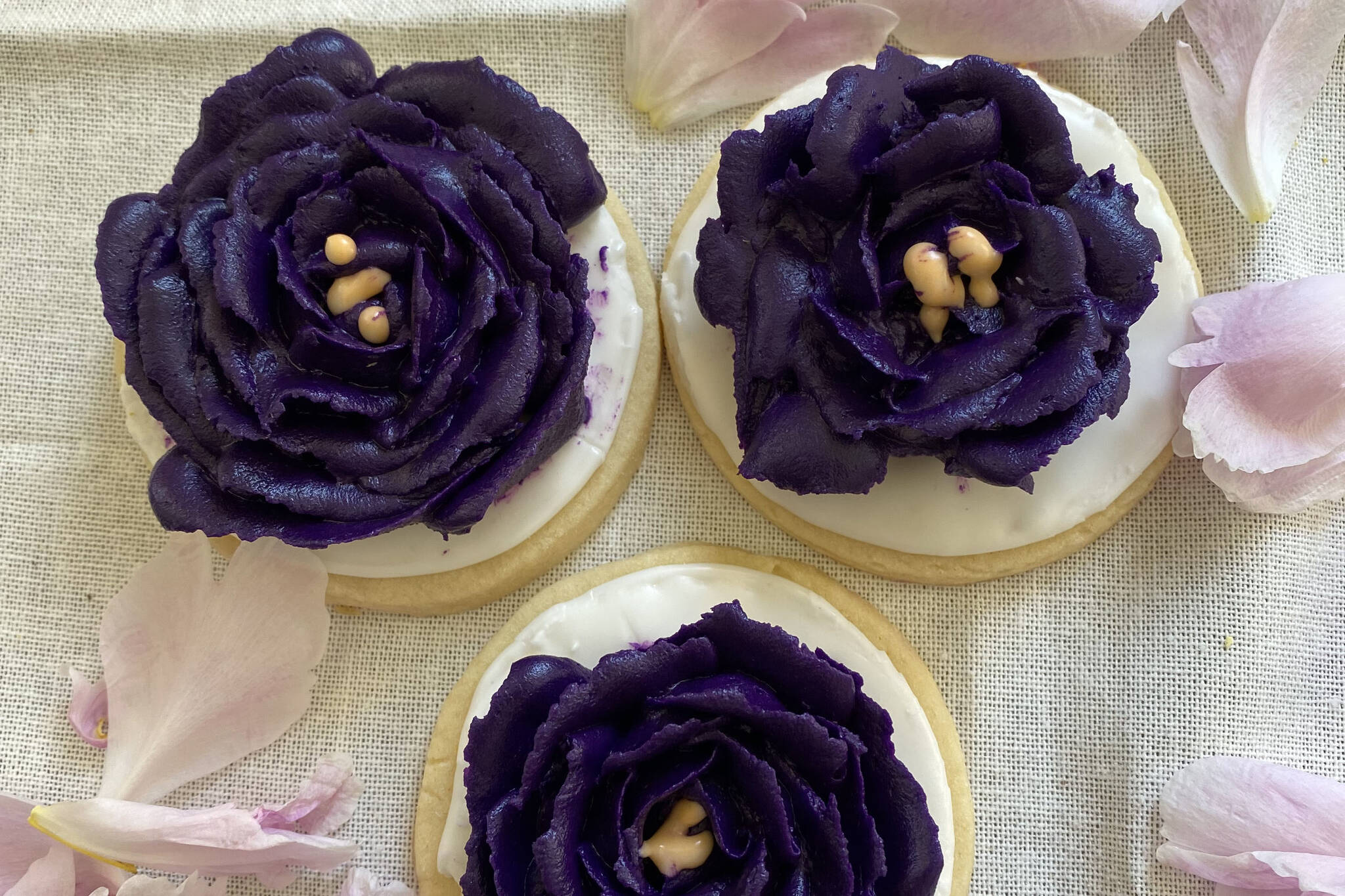 Sugar cookies are decorated with flowers of royal icing. (Photo by Tressa Dale/Peninsula Clarion)