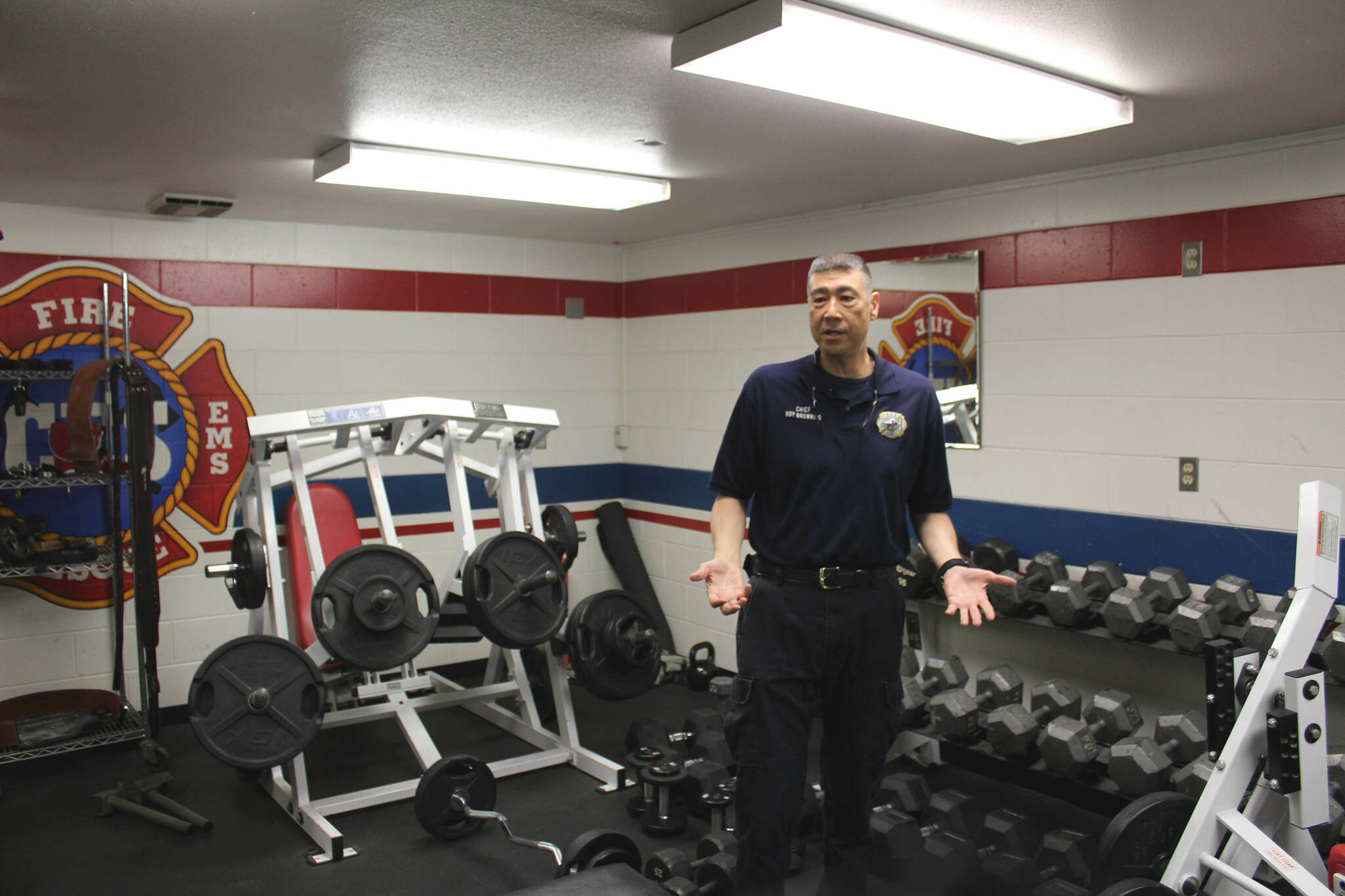 Central Emergency Services Fire Chief Roy Browning stands amid weights in the agency’s fitness room on Tuesday, July 26, 2022, in Soldotna, Alaska. (Ashlyn O’Hara/Peninsula Clarion)