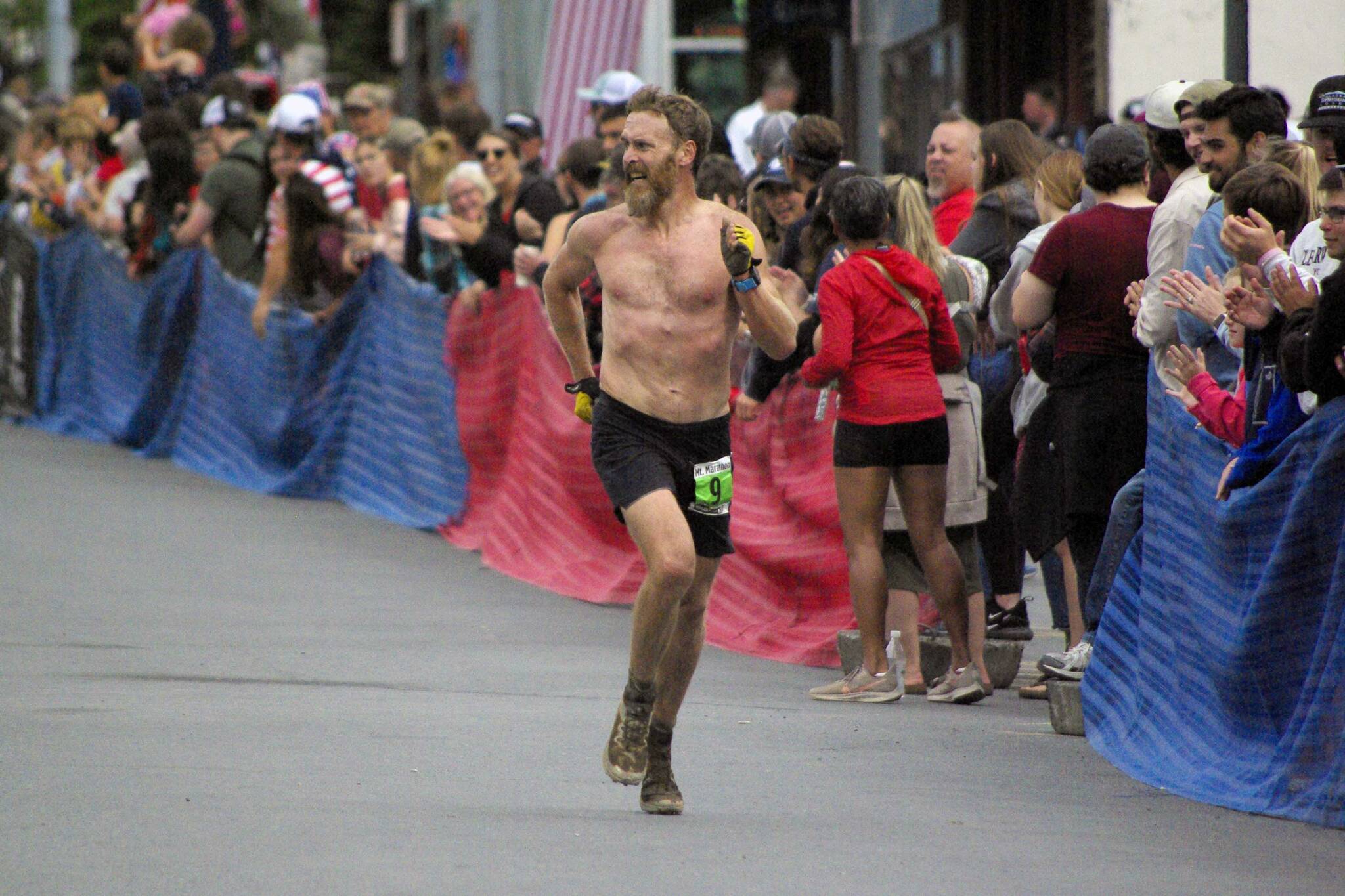 Seward's Erik Johnson finishes the men's Mount Marathon Race in Seward, Alaska, on Monday, July 4, 2022. (Photo by Jeff Helminiak/Peninsula Clarion)