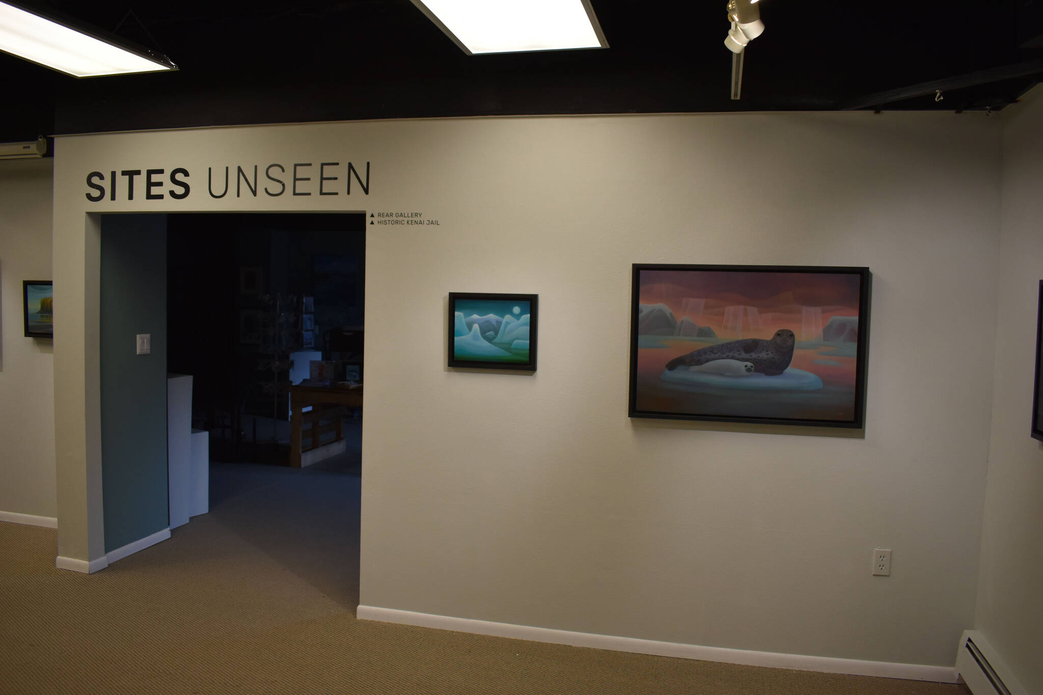 Artwork by Linda Infante Lyons hangs at the Kenai Art Center in Kenai, Alaska, on Tuesday, Aug. 2, 2022, as part of the “Sites Unseen” exhibition. (Jake Dye/Peninsula Clarion)