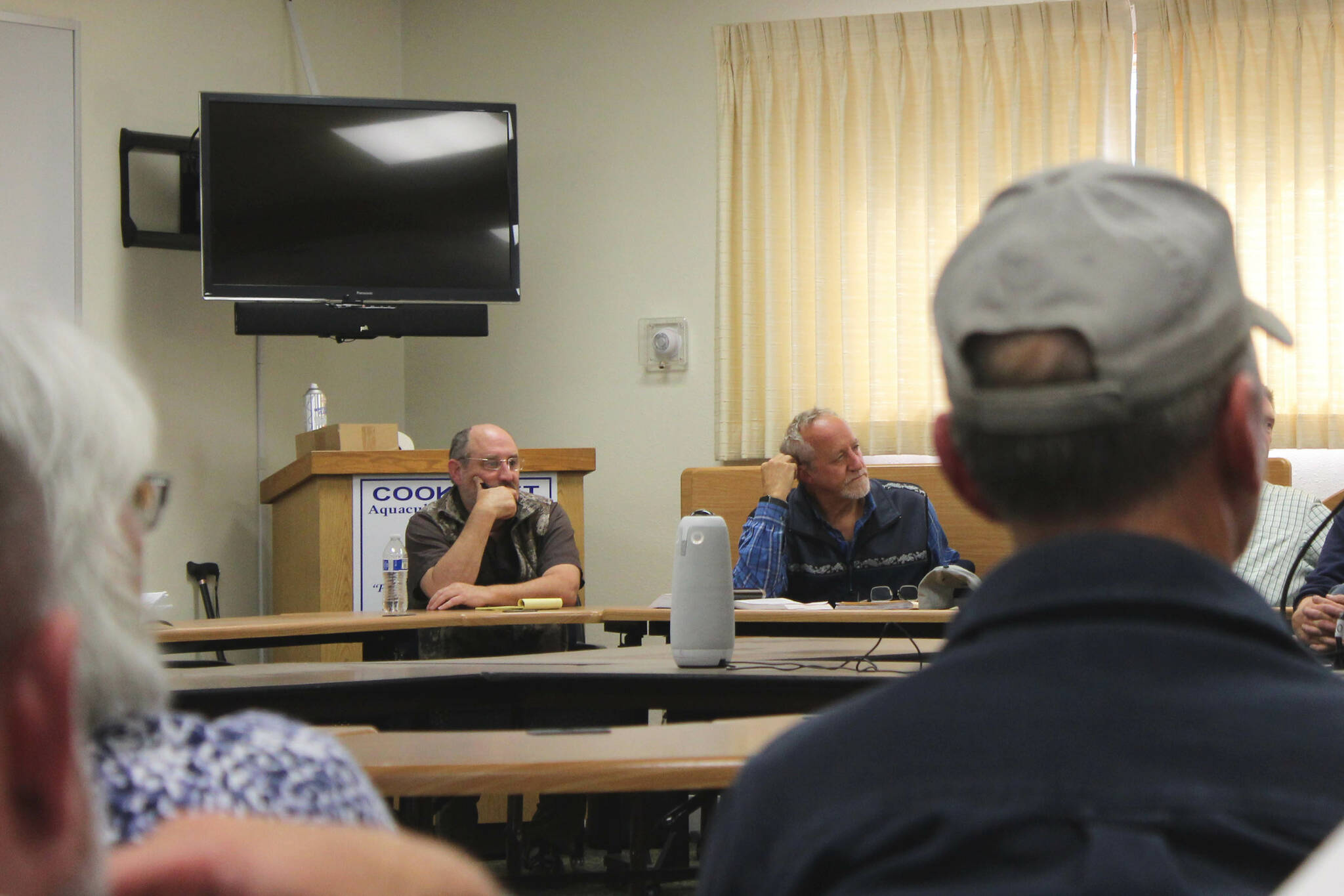 Alaska Department of Fish and Game Commissioner Doug Vincent-Lang, right, listens to east side setnet fisherman at the Cook Inlet Aquaculture Association building on Tuesday, Aug. 2, 2022, near Kenai, Alaska. (Ashlyn O’Hara/Peninsula Clarion)