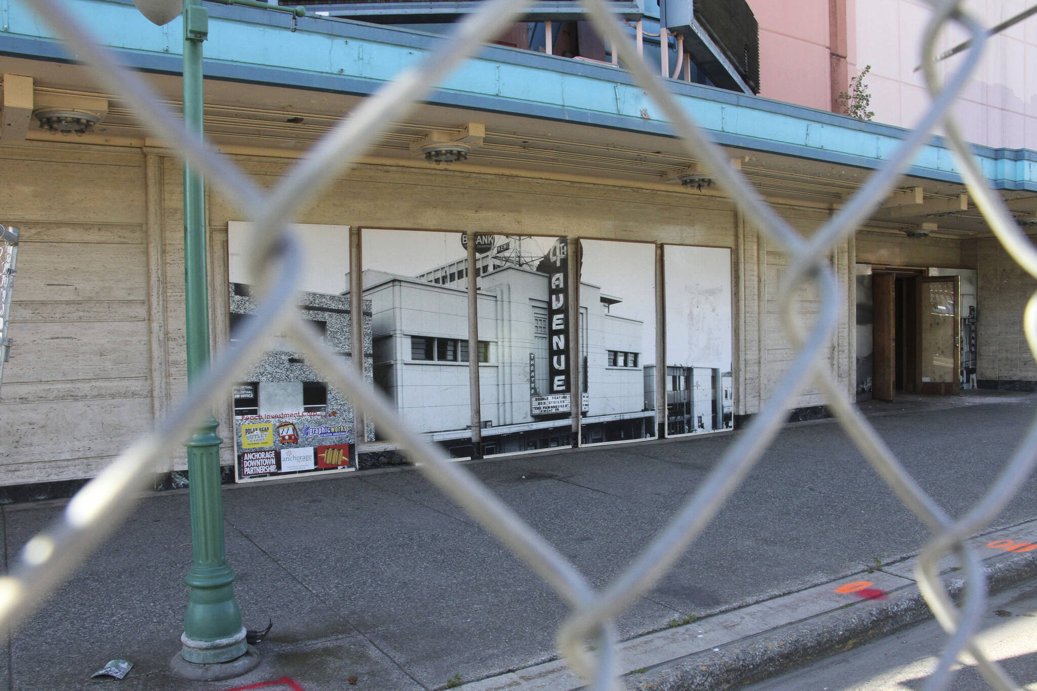 Fencing surrounds the 4th Avenue Theatre in Anchorage, Alaska, on Wednesday, Aug. 3, 2022. Demolition will begin in August 2022 on the once-opulent downtown Anchorage movie theater designed by the architect of Hollywood’s famed Pantages Theatre. The 4th Avenue Theatre with nearly 1,000 seats opened in 1947, and it withstood the second most powerful earthquake ever recorded. (AP Photo/Mark Thiessen)