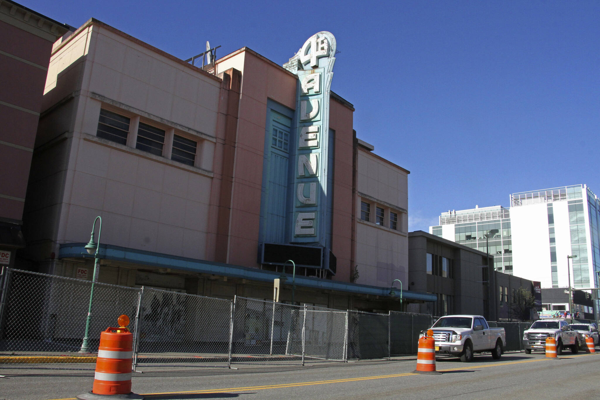 Fencing surrounds the 4th Avenue Theatre in Anchorage, Alaska, on Wednesday, Aug. 3, 2022. Demolition will begin in August 2022 on the once-opulent downtown Anchorage movie theater designed by the architect of Hollywood’s famed Pantages Theatre. The 4th Avenue Theatre with nearly 1,000 seats opened in 1947, and it withstood the second most powerful earthquake ever recorded. (AP Photo/Mark Thiessen)