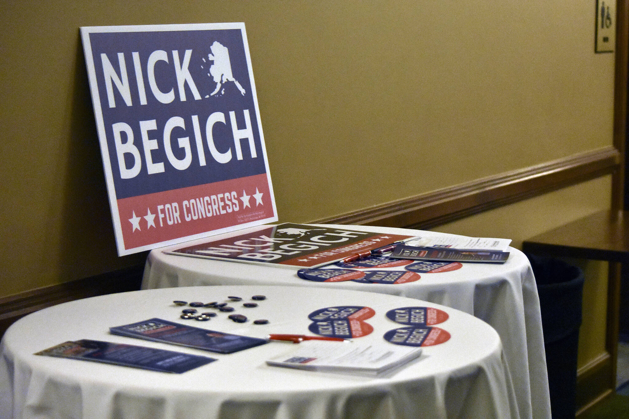 Nick Begich III campaign materials sit on tables ahead of a May 16 GOP debate held in Juneau. (Peter Segall / Juneau Empire File)