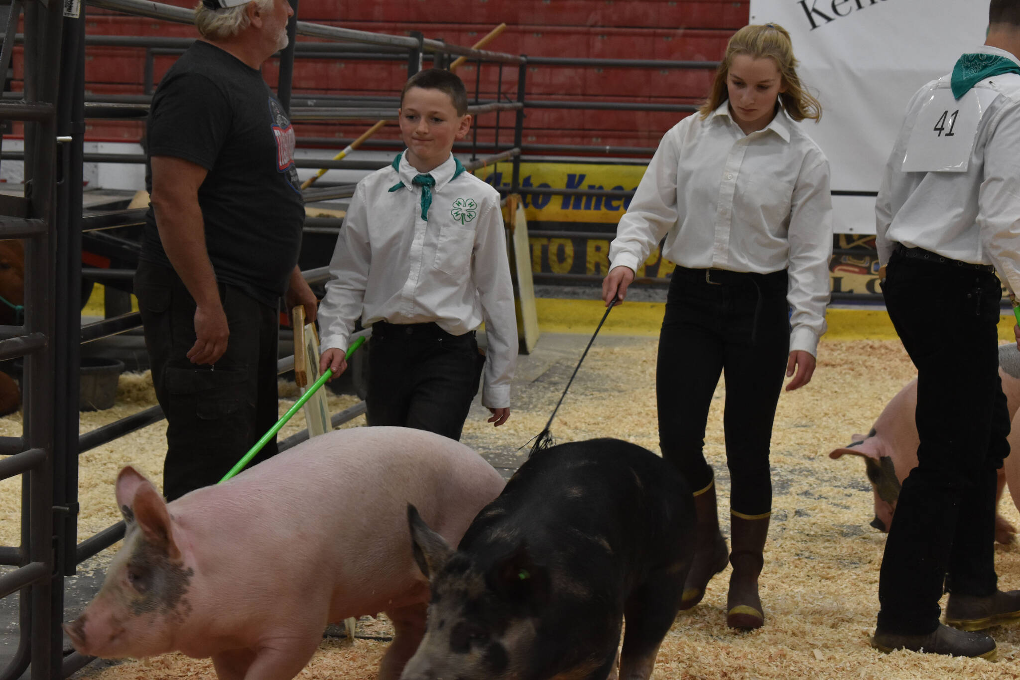 Abriella Werner shows a pig alongside another contestant at the 4-H Agriculture Expo in Soldotna, Alaska, on Aug. 5, 2022