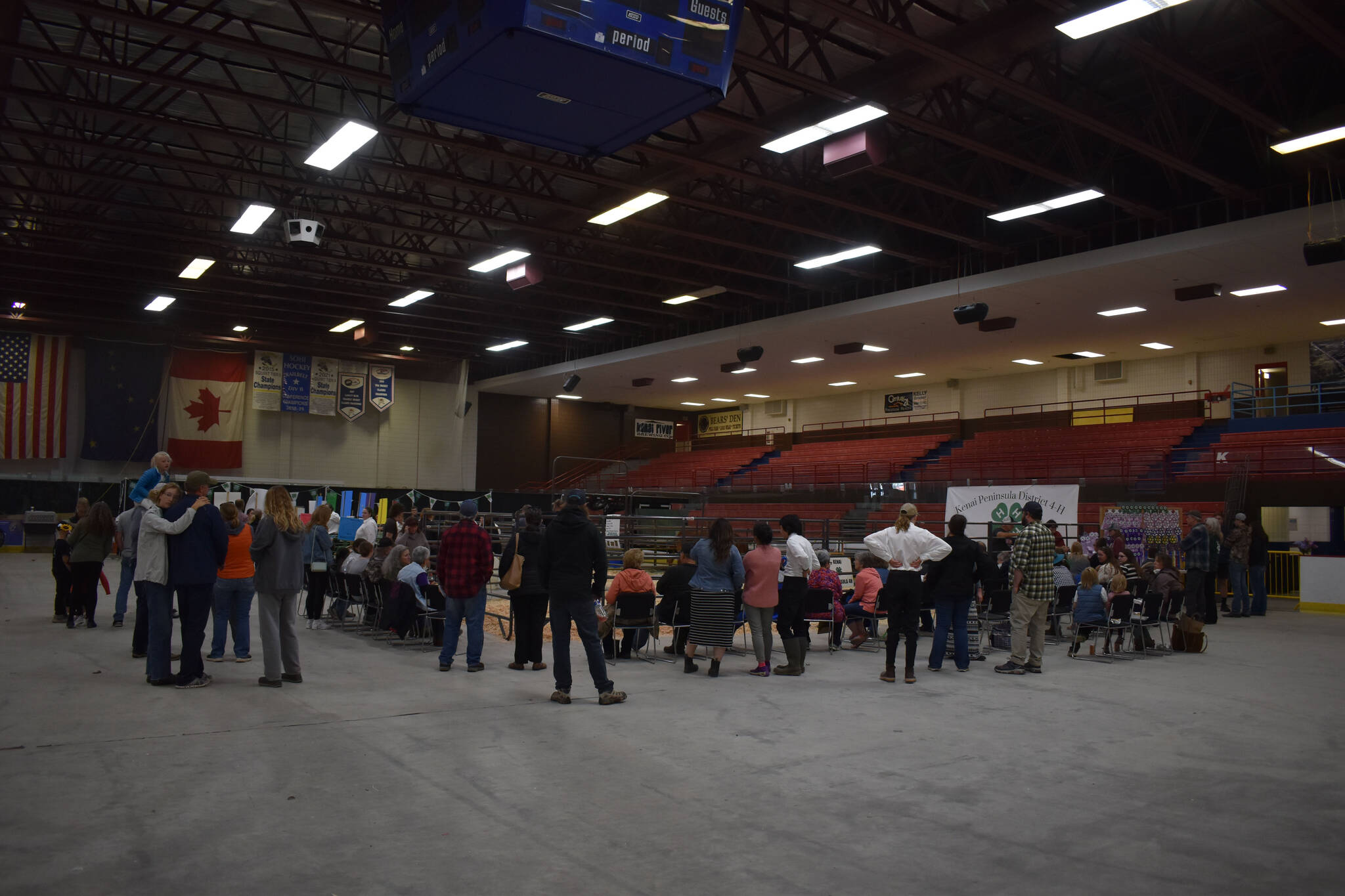 Attendees look on the arena where animals are being shown at the 4-H Agriculture Expo in Soldotna, Alaska, on Aug. 5, 2022. (Jake Dye/Peninsula Clarion)