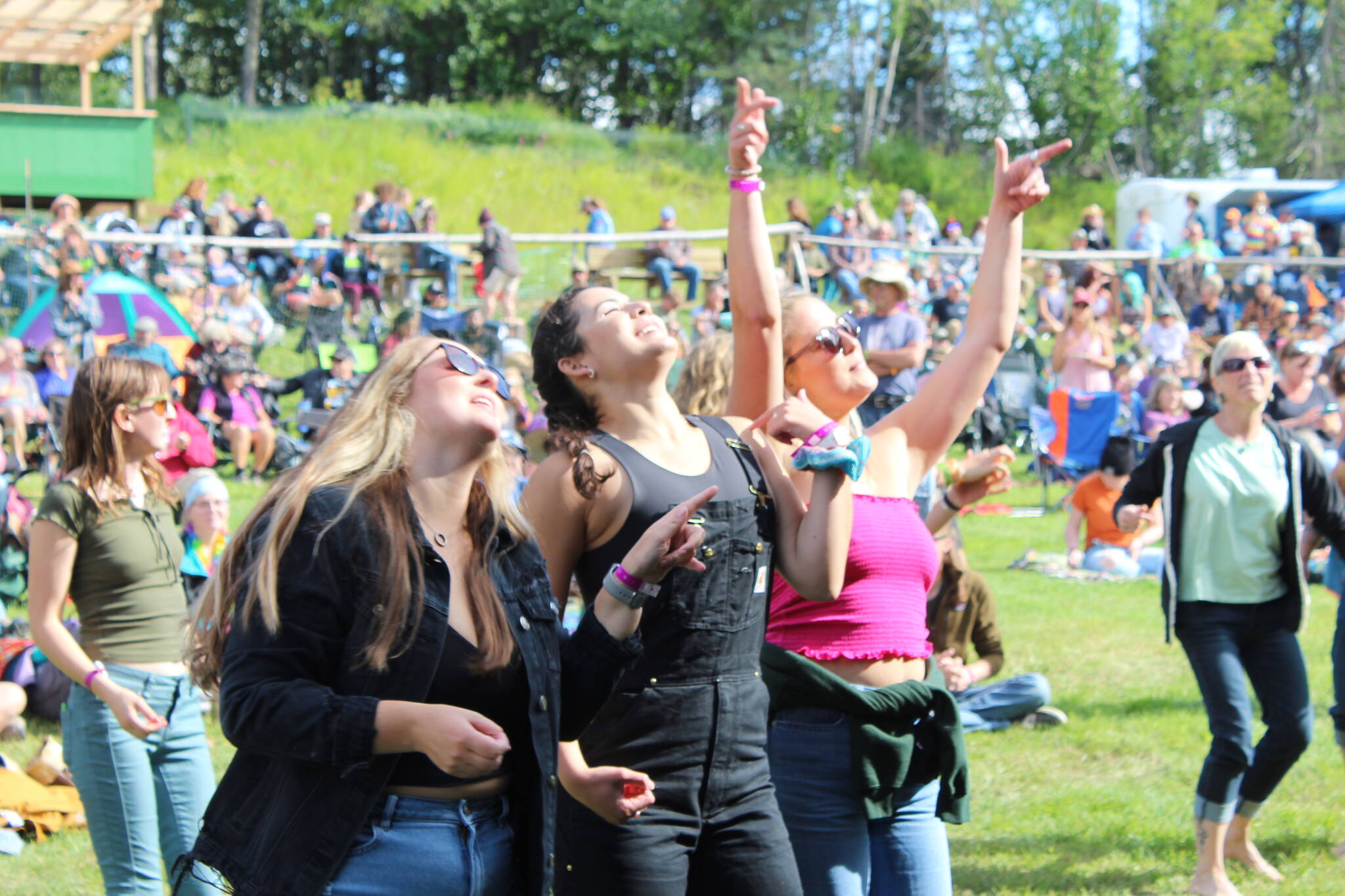 People gather in Ninilchik, Alaska, on Friday, Aug. 5, 2022, for Salmonfest, an annual event that raises awareness about salmon-related causes. (Camille Botello/Peninsula Clarion)