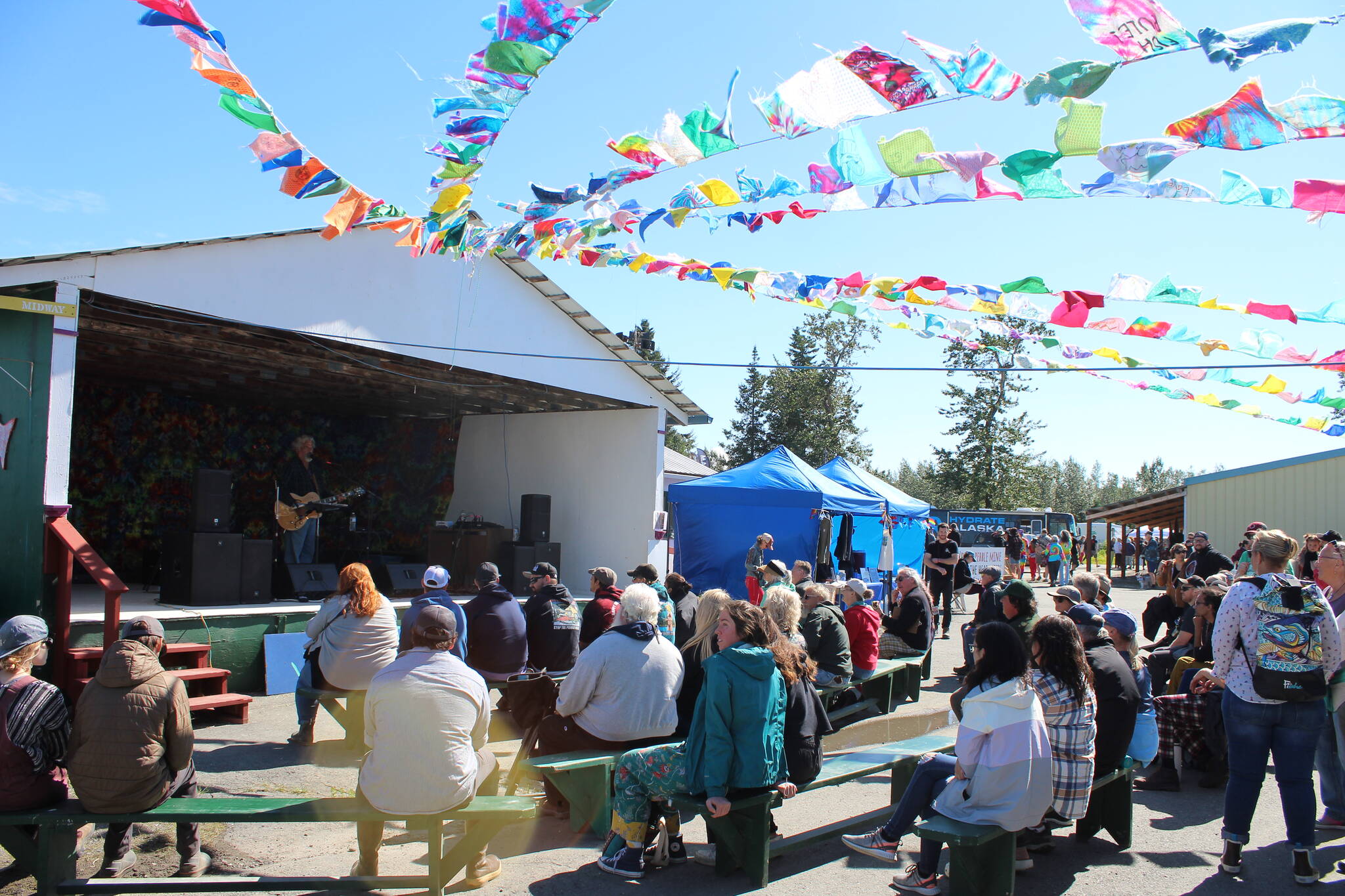 People gather in Ninilchik, Alaska on Friday, Aug. 5, 2022 for Salmonfest, an annual event that raises awareness about salmon-related causes. (Ashlyn O’Hara/Peninsula Clarion)