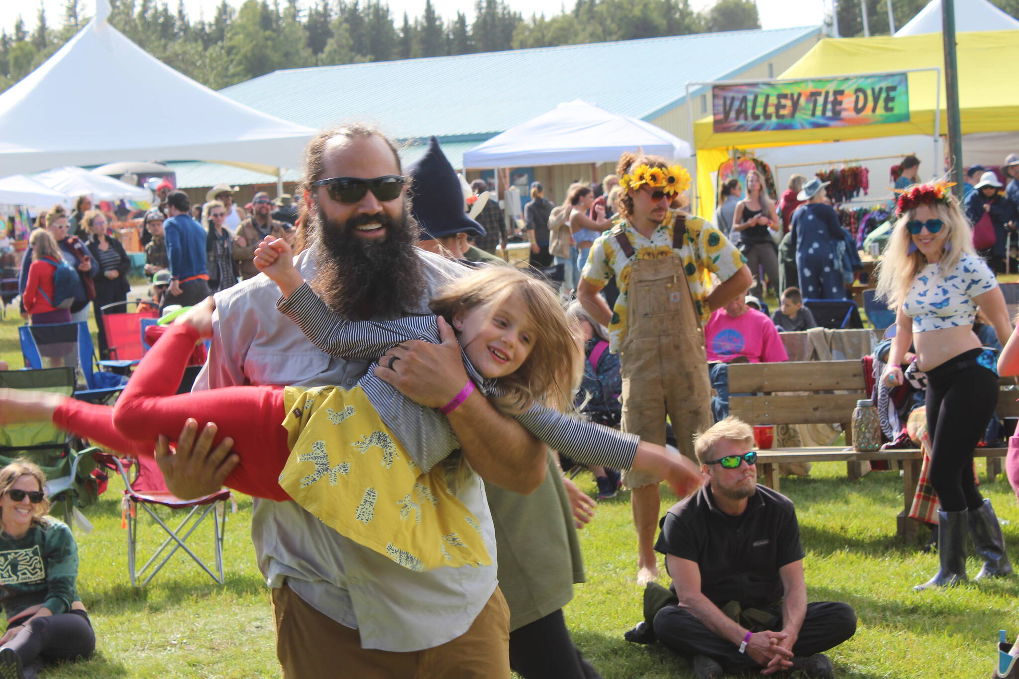 People gather in Ninilchik, Alaska on Friday, Aug. 5, 2022 for Salmonfest, an annual event that raises awareness about salmon-related causes. (Camille Botello/Peninsula Clarion)