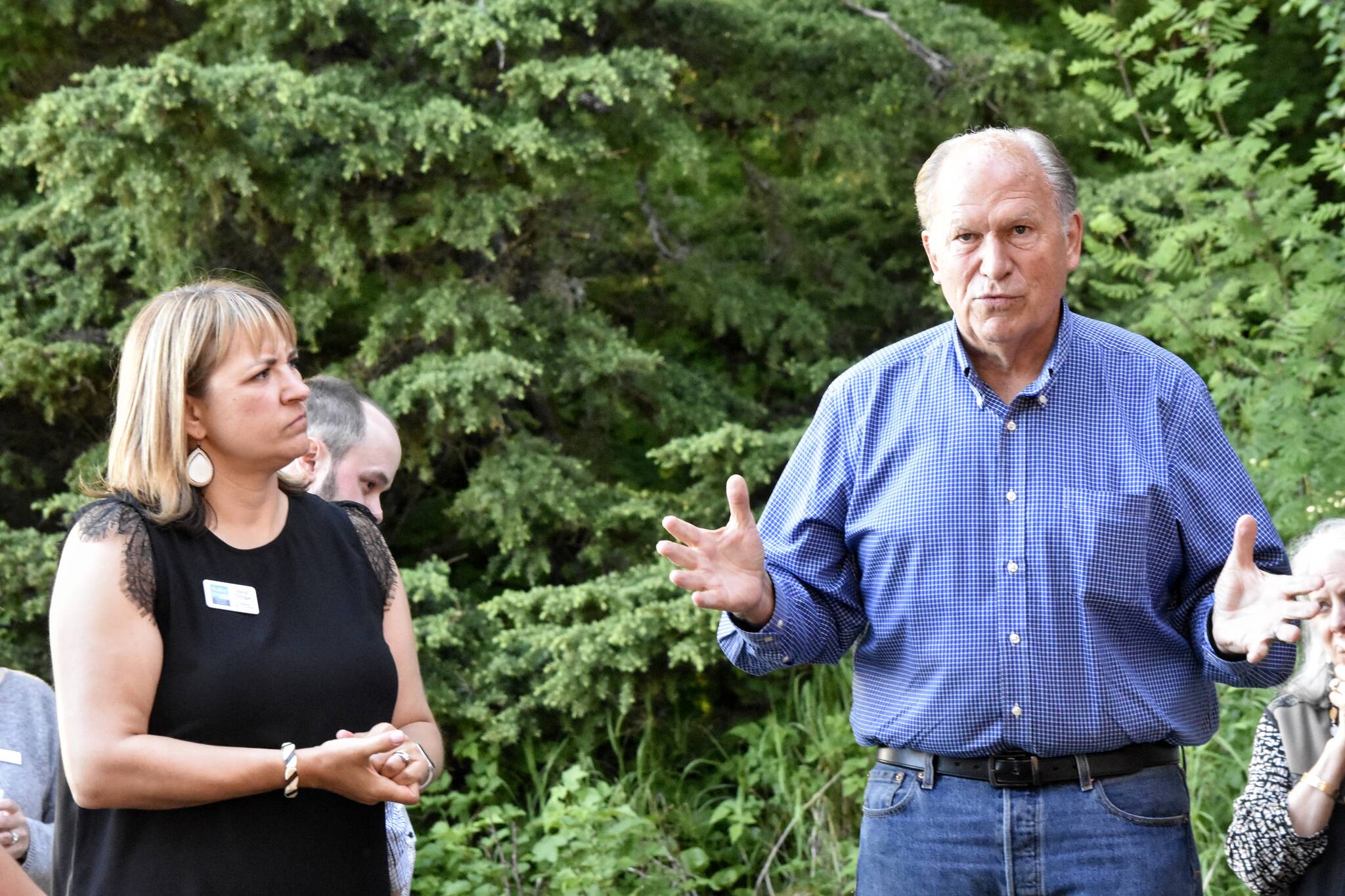 Former Gov. Bill Walker, right, and his running mate former commissioner of the Department of Labor and Workforce Development Heidi Drygas, speak to Juneauites gathered for a fundraiser at a private home in Juneau on Tuesday, June 7, 2022. (Peter Segall / Juneau Empire File)