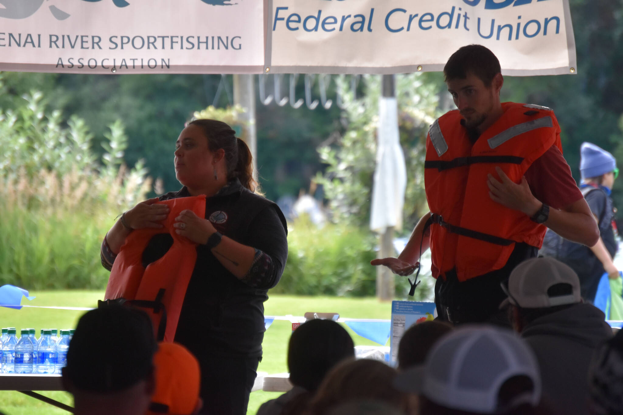 Representatives of the Alaska Office of Boating Safety deliver a presentation on water safety in cold Alaska rivers during the Kenai River Junior Classic in Soldotna, Alaska, on Aug. 10, 2022. (Jake Dye/Peninsula Clarion)