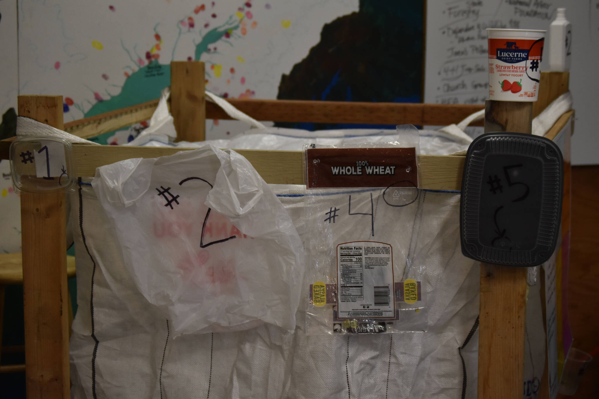Examples of desired recyclables are displayed on the recycling super sack at the Cook Inletkeeper Community Action Studio in Soldotna, Alaska, on Aug. 11, 2022. (Jake Dye/Peninsula Clarion)