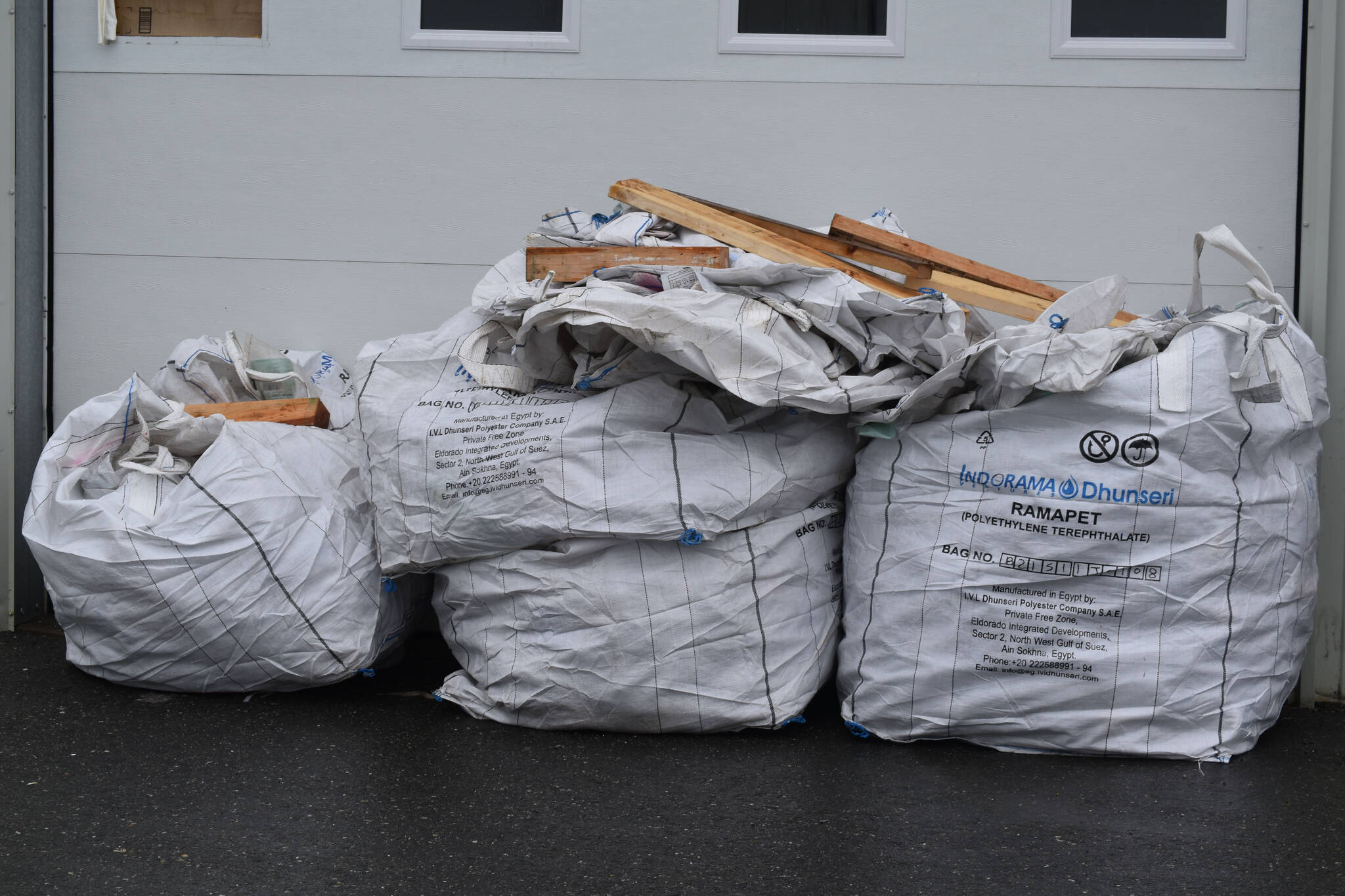 Full recycling super sacks ready to be delivered to Seward sit behind the Cook Inletkeeper Community Action Studio in Soldotna, Alaska, on Aug. 11, 2022. (Jake Dye/Peninsula Clarion)