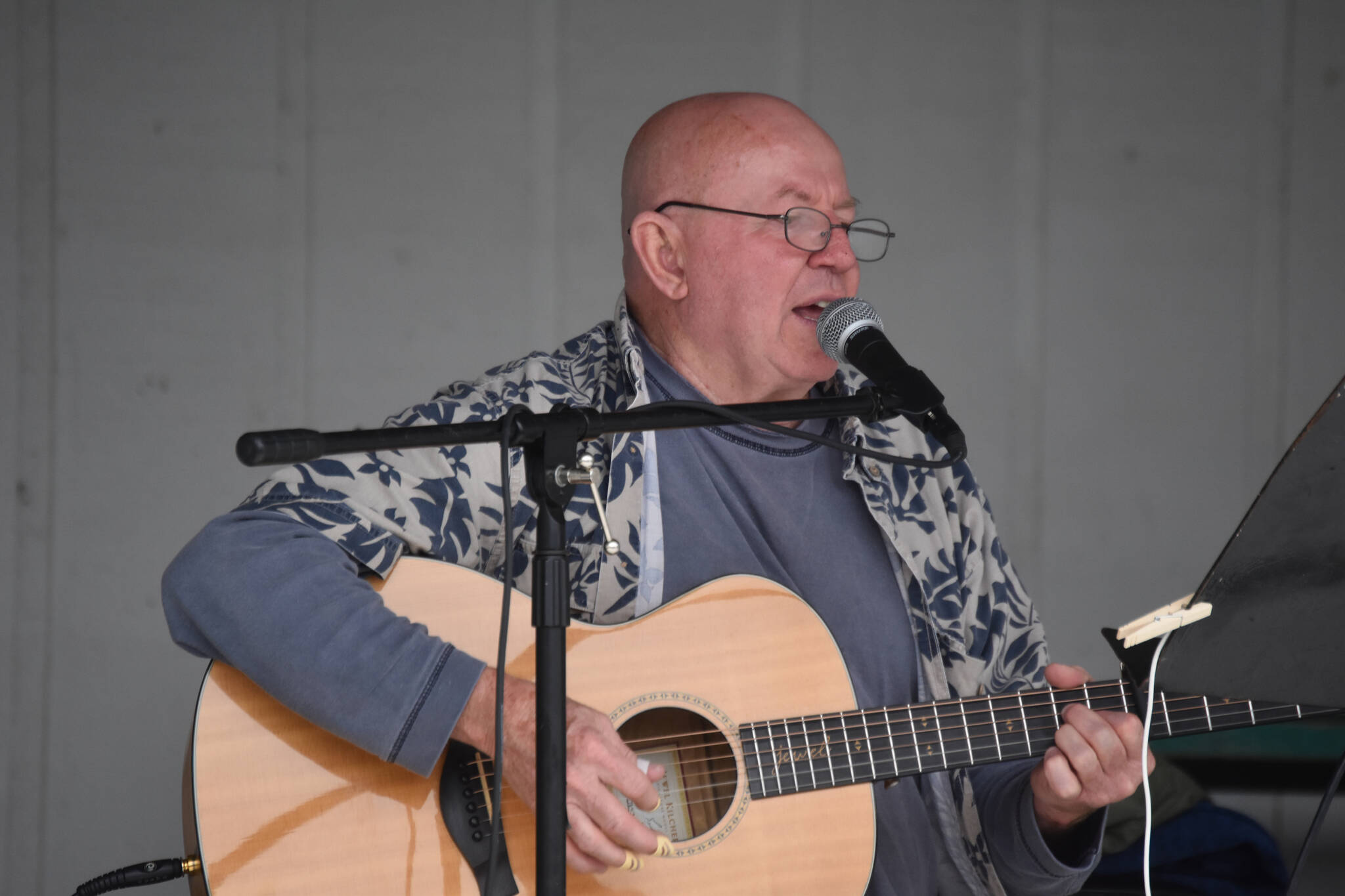 Mike Morgan sings and plays guitar on the Inlet Stage at the Kenai Peninsula Fair on Aug. 12, 2022, in Ninilchik, Alaska. (Jake Dye/Peninsula Clarion)