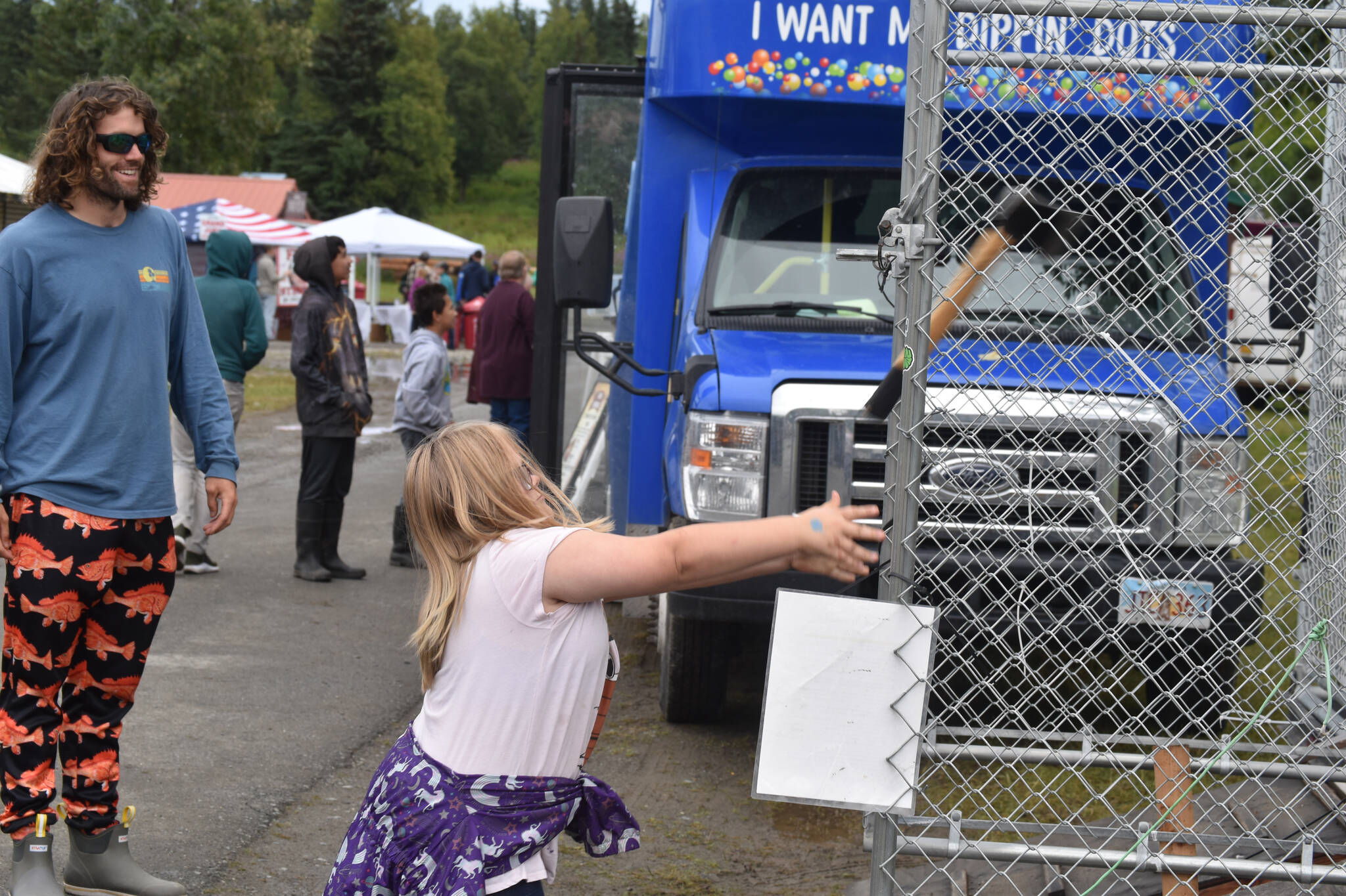 An ax is thrown at the Kenai Peninsula Fair on Aug. 12, 2022, in Ninilchik, Alaska. (Jake Dye/Peninsula Clarion)