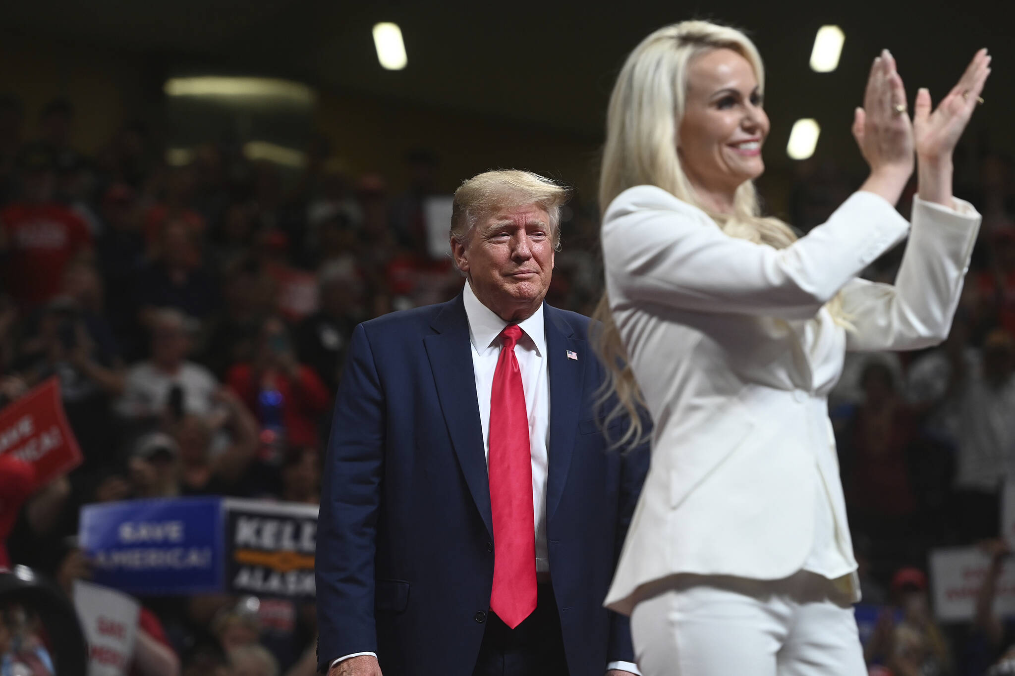 U.S. Senate candidate Kelly Tshibaka joins Donald Trump on stage during a rally at the Alaska Airlines Center on July 9, 2022, in Anchorage, Alaska. Tshibaka is seeking to become one of four candidates to advance in the U.S. Senate race during Alaska’s primary election Tuesday, Aug. 16. (Bill Roth/Anchorage Daily News via AP, File)
U.S. Senate candidate Kelly Tshibaka joins Donald Trump on stage during a rally at the Alaska Airlines Center on July 9, 2022, in Anchorage, Alaska. Tshibaka is seeking to become one of four candidates to advance in the U.S. Senate race during Alaska’s primary election Tuesday, Aug. 16. (Bill Roth/Anchorage Daily News via AP, File)