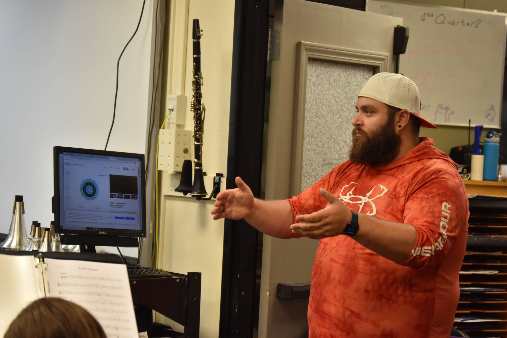 Christian Stephanos directs the KCHS Marching Band during a practice on Aug. 18, 2022, in Kenai, Alaska. (Jake Dye/Peninsula Clarion)