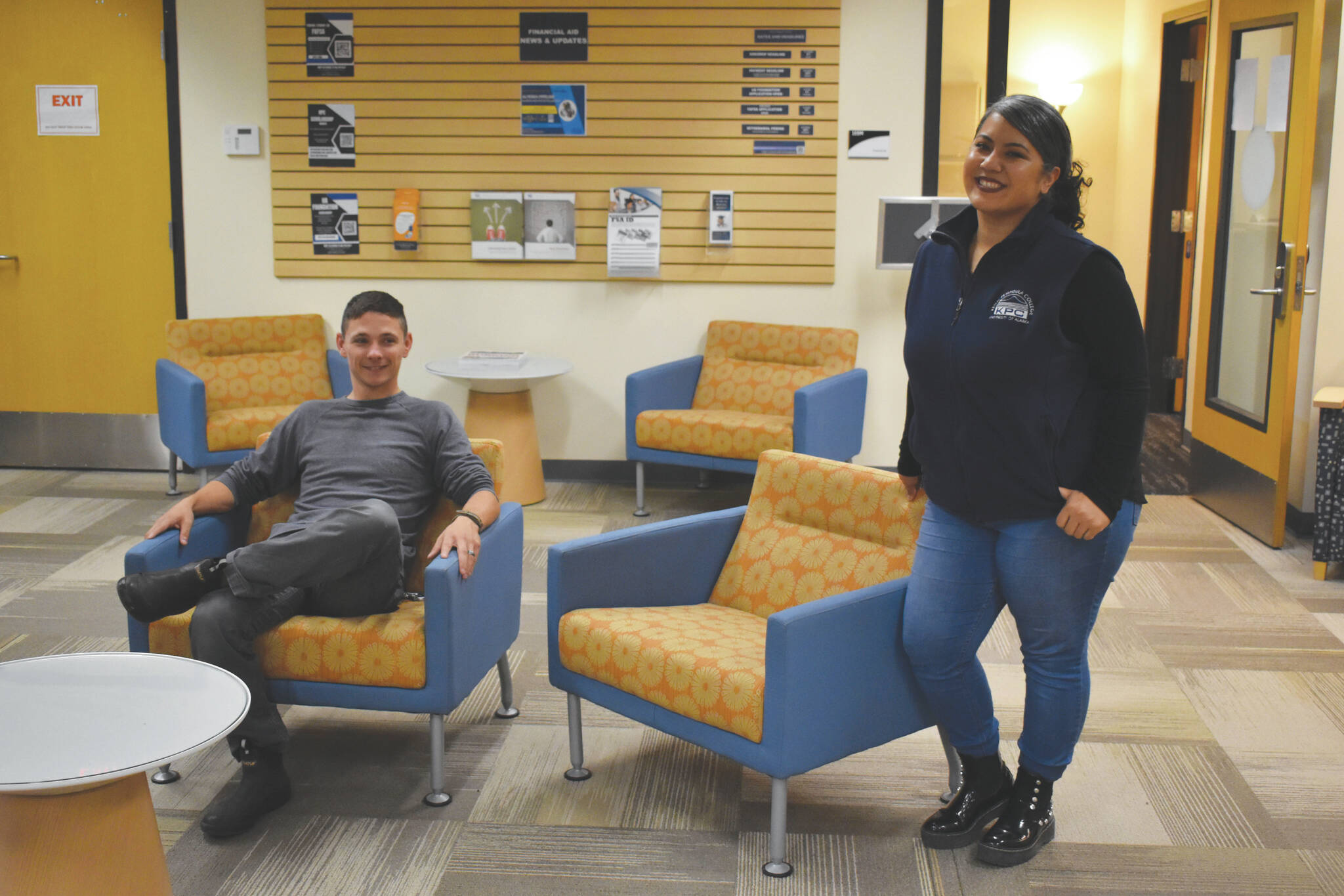 photos by Jake Dye / Peninsula Clarion 
Alex LeClair, Kenai Peninsula College enrollment specialist, and Natasha Sison, financial aid specialist with the KPC Financial Aid Office, are seen in the Kenai Peninsula College Student Services Office on Thursday near Soldotna.