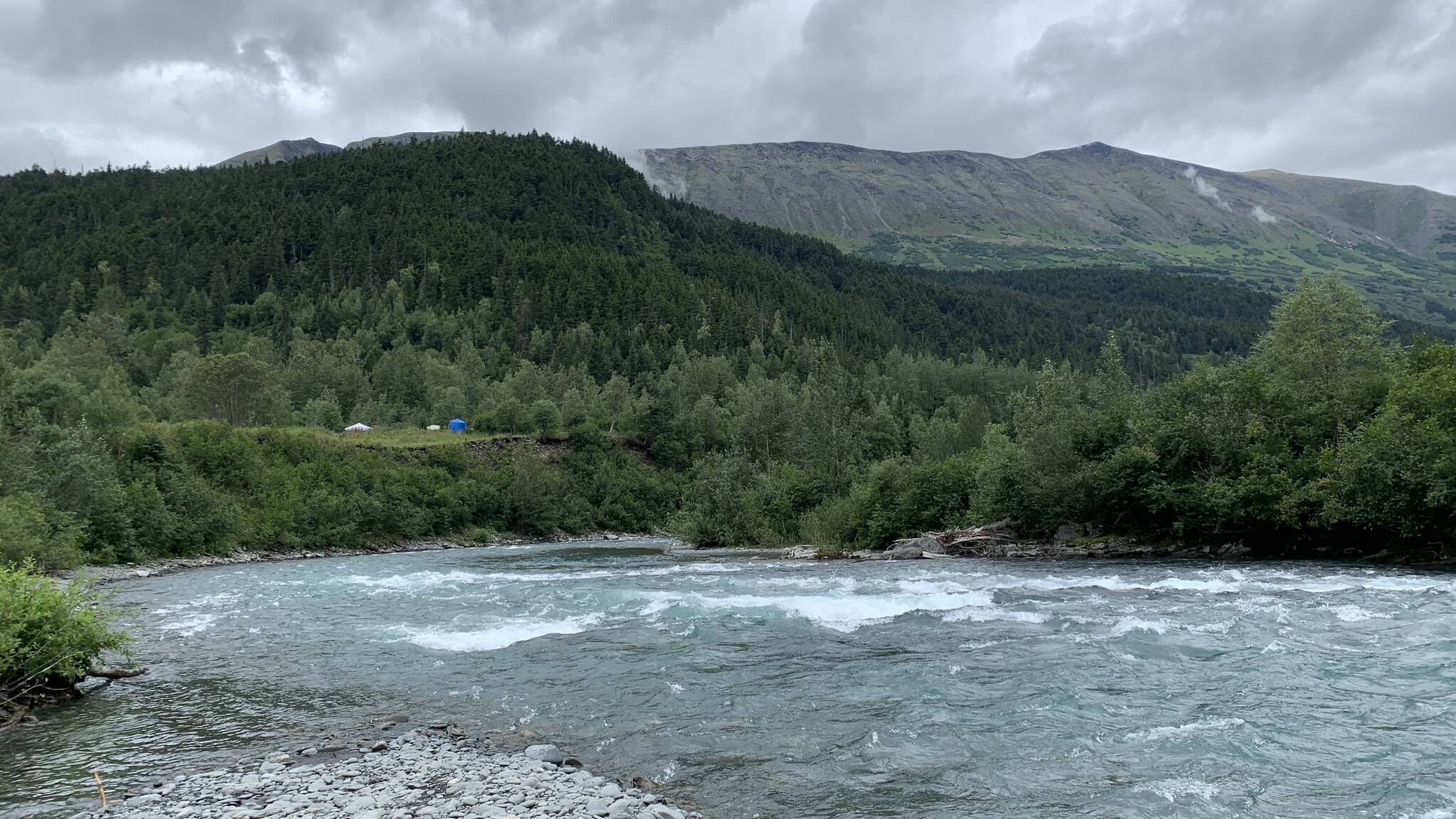 People camp above a river on Sunday, July 31, 2022 near Hope, Alaska. (Ashlyn O'Hara/Peninsula Clarion)