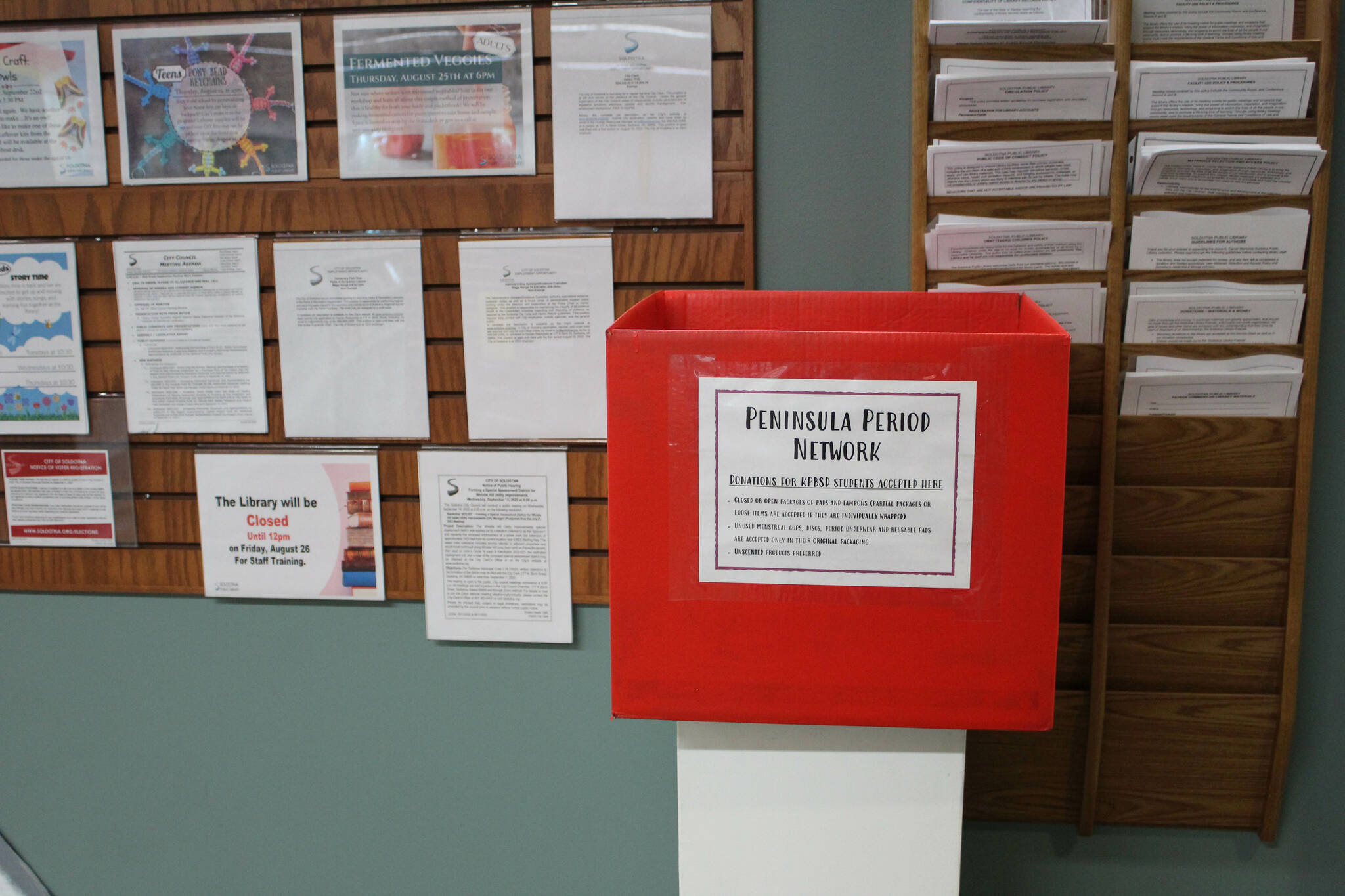 A box collects menstruation products for the Peninsula Period Network at the Soldotna Public Library on Tuesday, Aug. 23, 2022 in Soldotna, Alaska. (Ashlyn O’Hara/Peninsula Clarion)