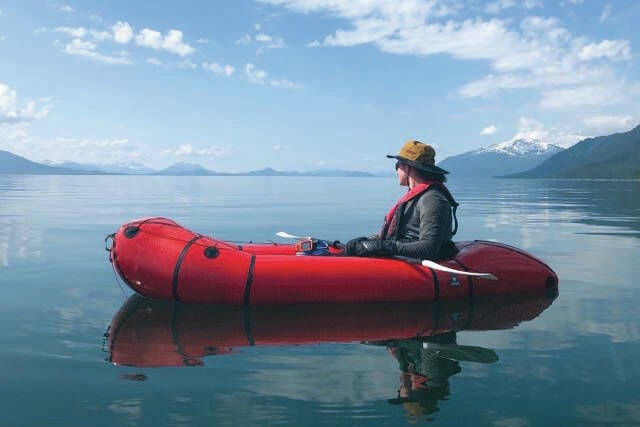 Steven Ireland-Haight sits in his retired packraft early on in his yearlong trip to paddle and walk from Juneau to Washington, D.C., to raise money and awareness about climate change. (Photo courtesy Owen Squires)