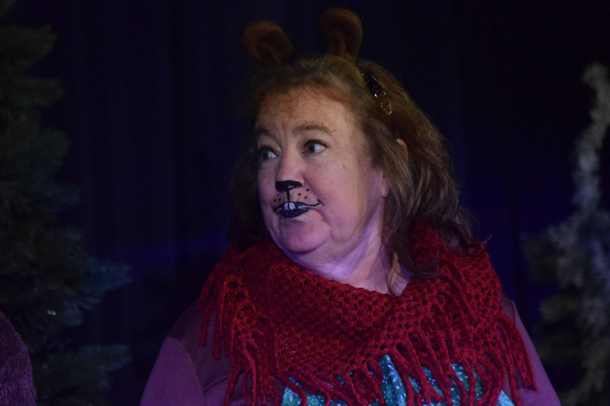 Terri Burdick acts as her character Mrs. Burdick during the Triumvirate Theater’s rehearsal of “The Chronicles of Narnia: The Lion, the Witch and the Wardrobe” at Kenai Central High School on Tuesday, Dec. 14, 2021. (Camille Botello/Peninsula Clarion)