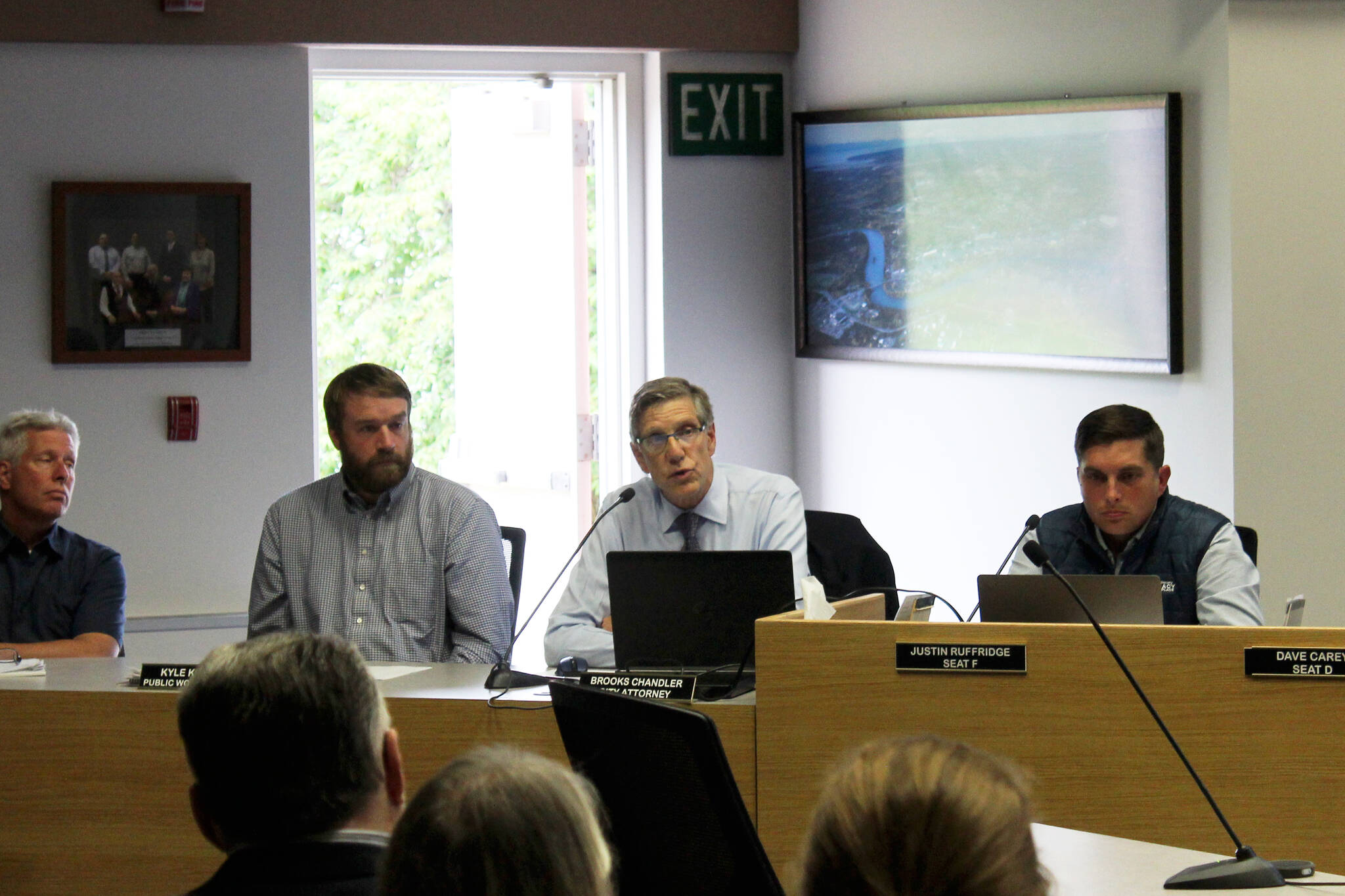 Soldotna City Attorney Brooks Chandler (center) discussess how Soldotna Creek Park can and cannot be used by members of the public during a meeting of the Soldotna City Council on Wednesday, July 13, 2022 in Soldotna, Alaska. (Ashlyn O’Hara/Peninsula Clarion)